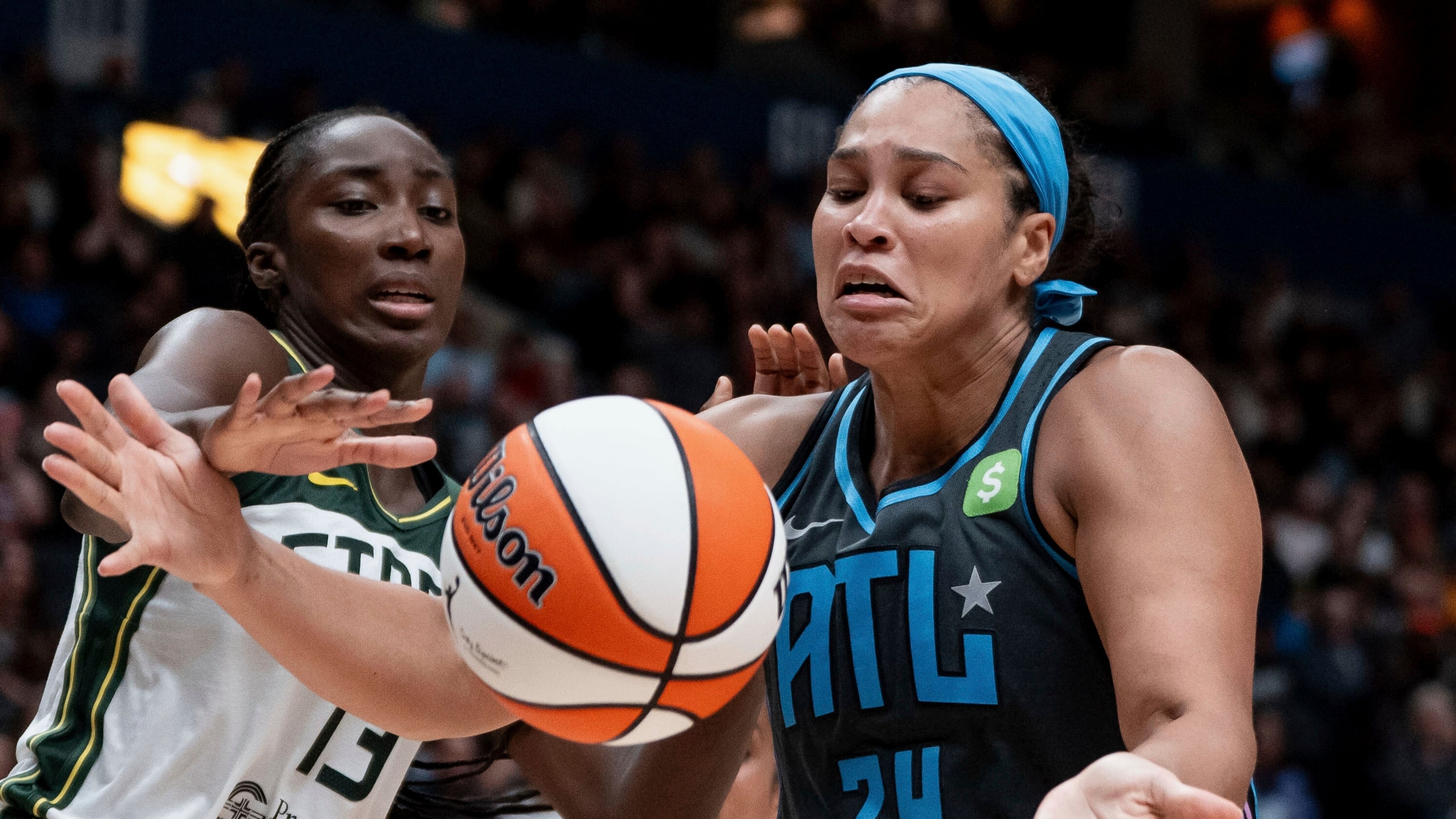 FILE - Atlanta Dream's Brionna Jones (24) fights for the ball against Seattle Storm's Ezi Magbegor (13) during the second half of a WNBA basketball game in Vancouver, British Columbia, Aug. 15, 2025. (Ethan Cairns/The Canadian Press via AP, File)
