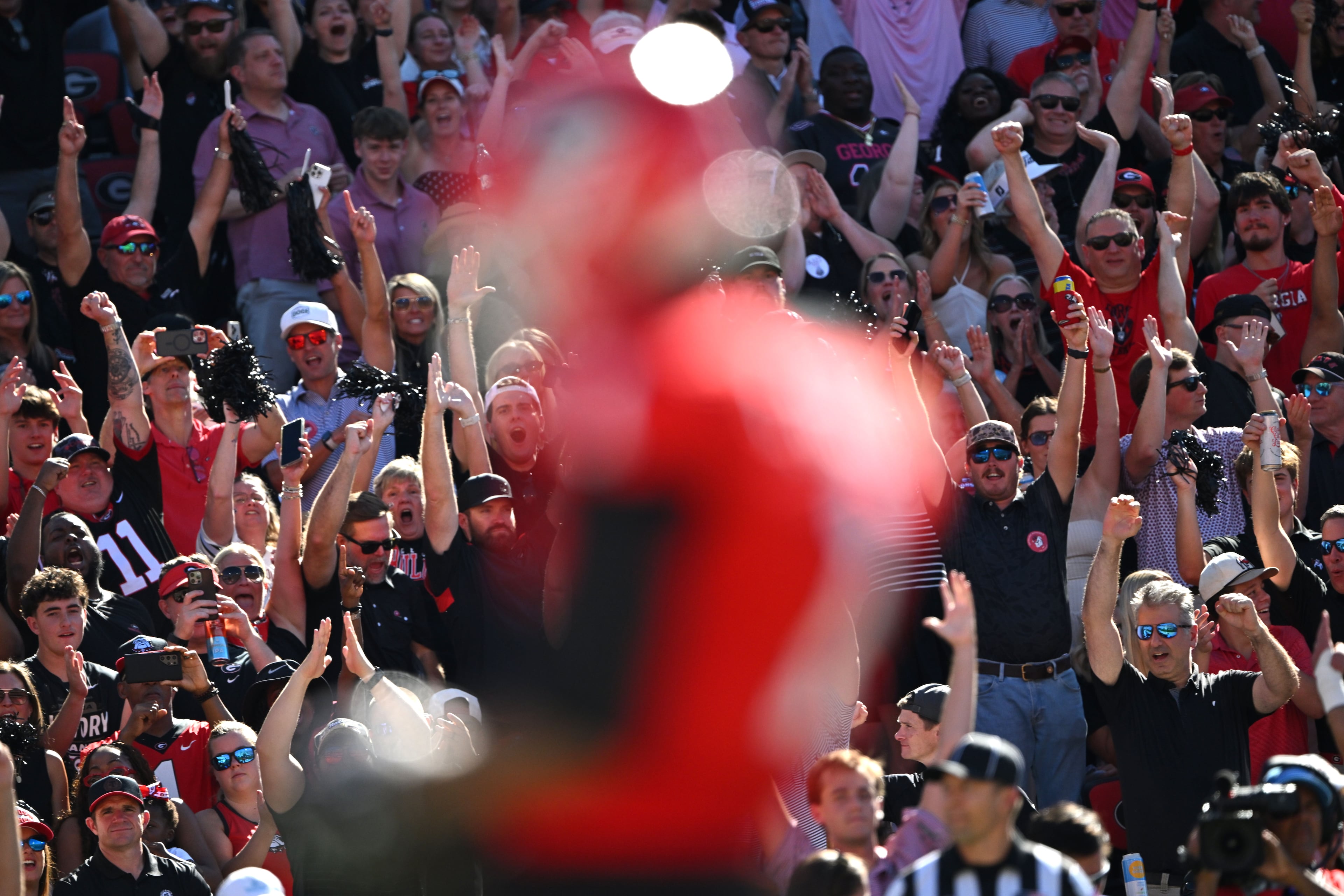 Georgia fans cheer as wide receiver Talyn Taylor makes a touchdown catch over Oklahoma defensive back Reggie Powers III during the first half in an NCAA football game at Sanford Stadium on Saturday, Sept. 26, 2026, in Athens, Ga. (Hyosub Shin/AJC)