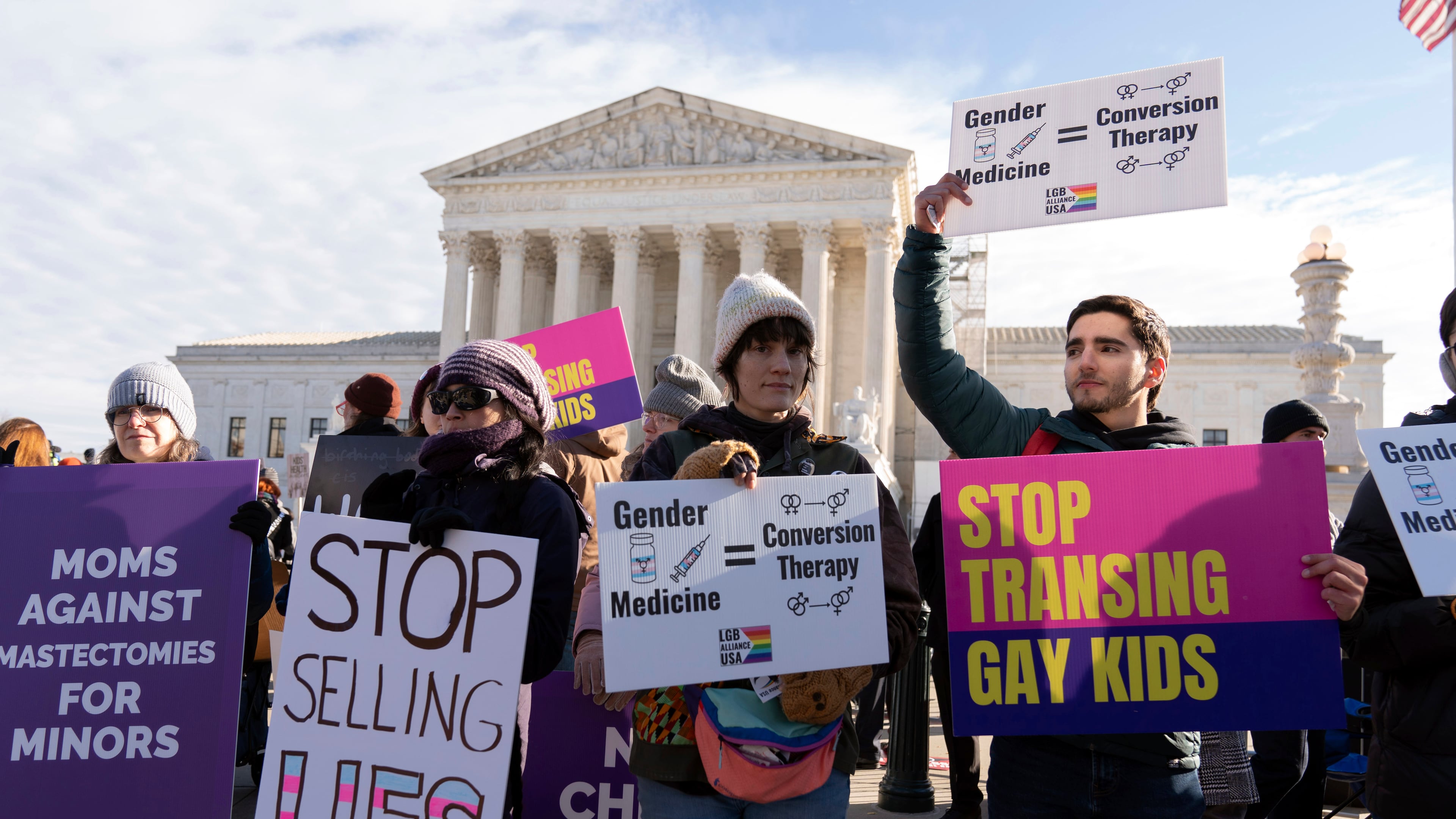 FILE - Demonstrators against transgenders rights protest during a rally outside of the Supreme Court, Dec. 4, 2024, in Washington. (AP Photo/Jose Luis Magana, File)