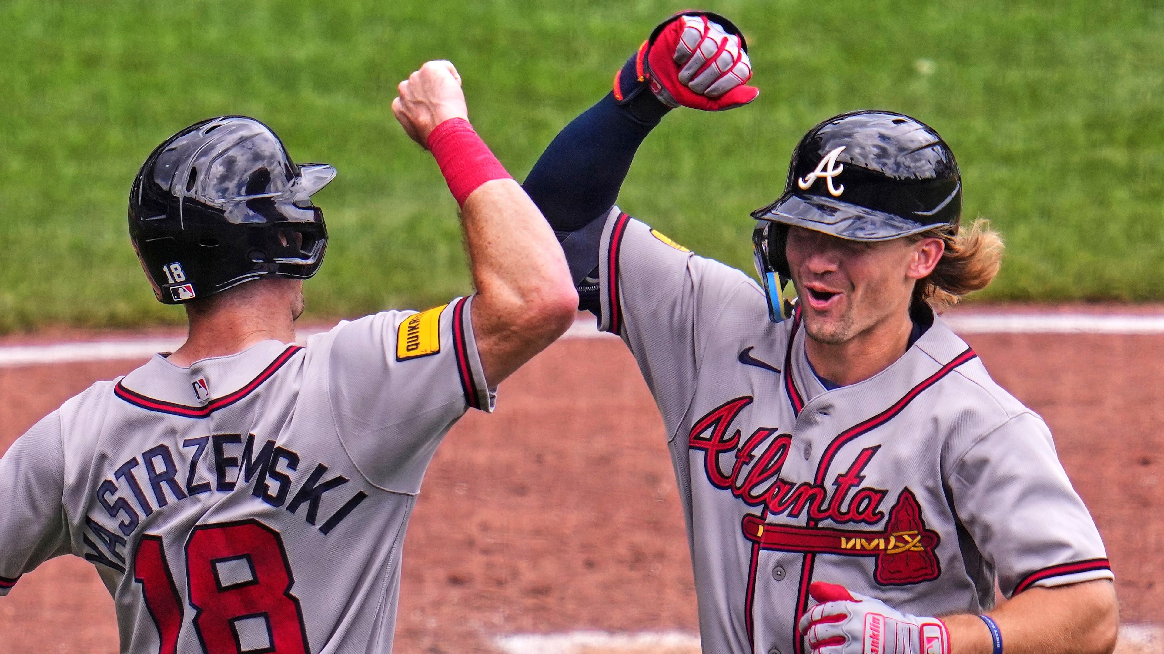 Atlanta Braves' Jim Jarvis, right, celebrates with Mike Yastrzemski (18) as he returns to the dugout after hitting a two-run home run off Pittsburgh Pirates pitcher Cam Sanders during the fourth inning of a baseball game in Pittsburgh, Thursday, July 9, 2026. (AP Photo/Gene J. Puskar)