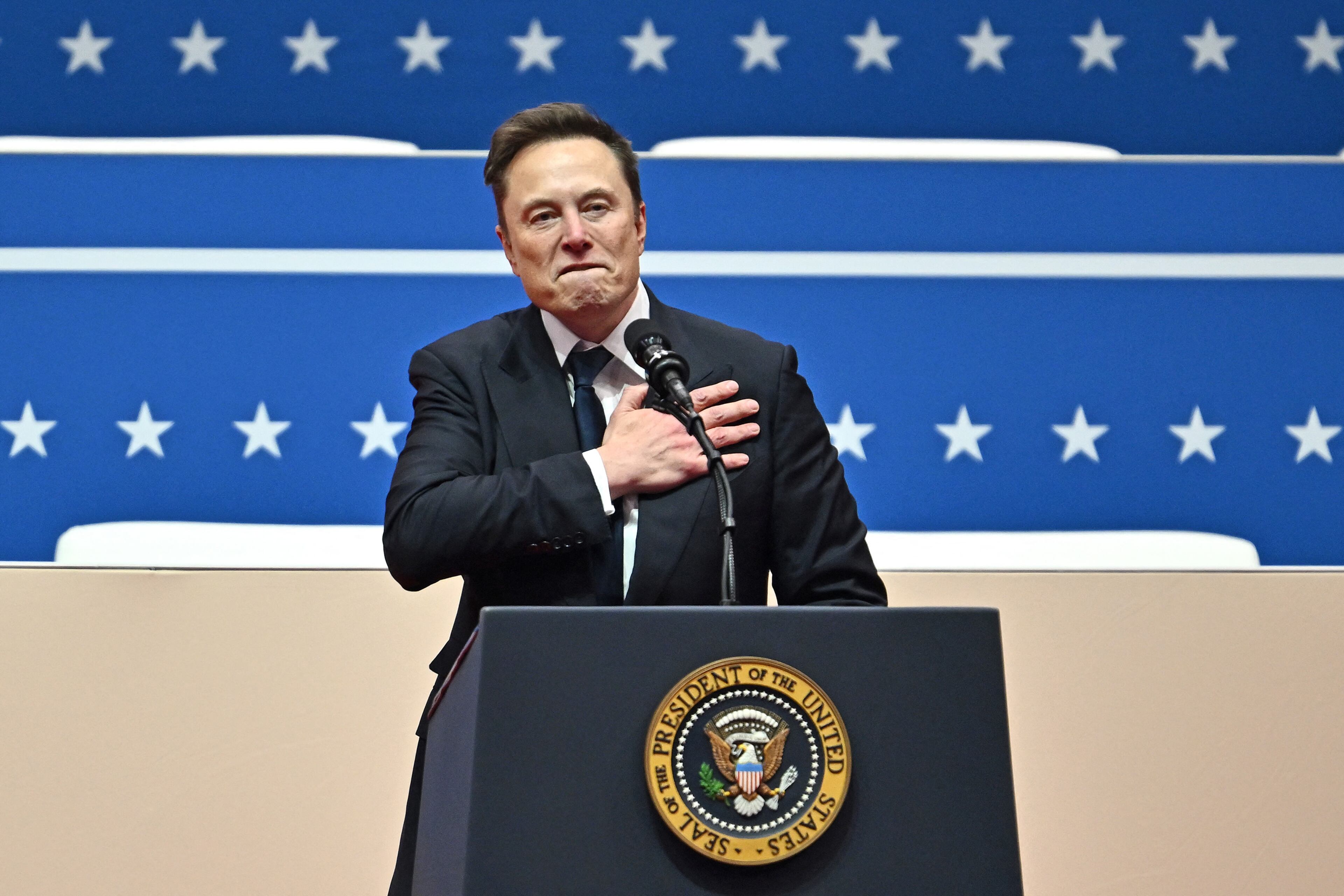 Tesla and SpaceX CEO Elon Musk gestures as he speaks during the inaugural parade inside Capitol One Arena, in Washington, D.C., on Monday, Jan. 20, 2025. (Angela Weiss/AFP/Getty Images/TNS)
