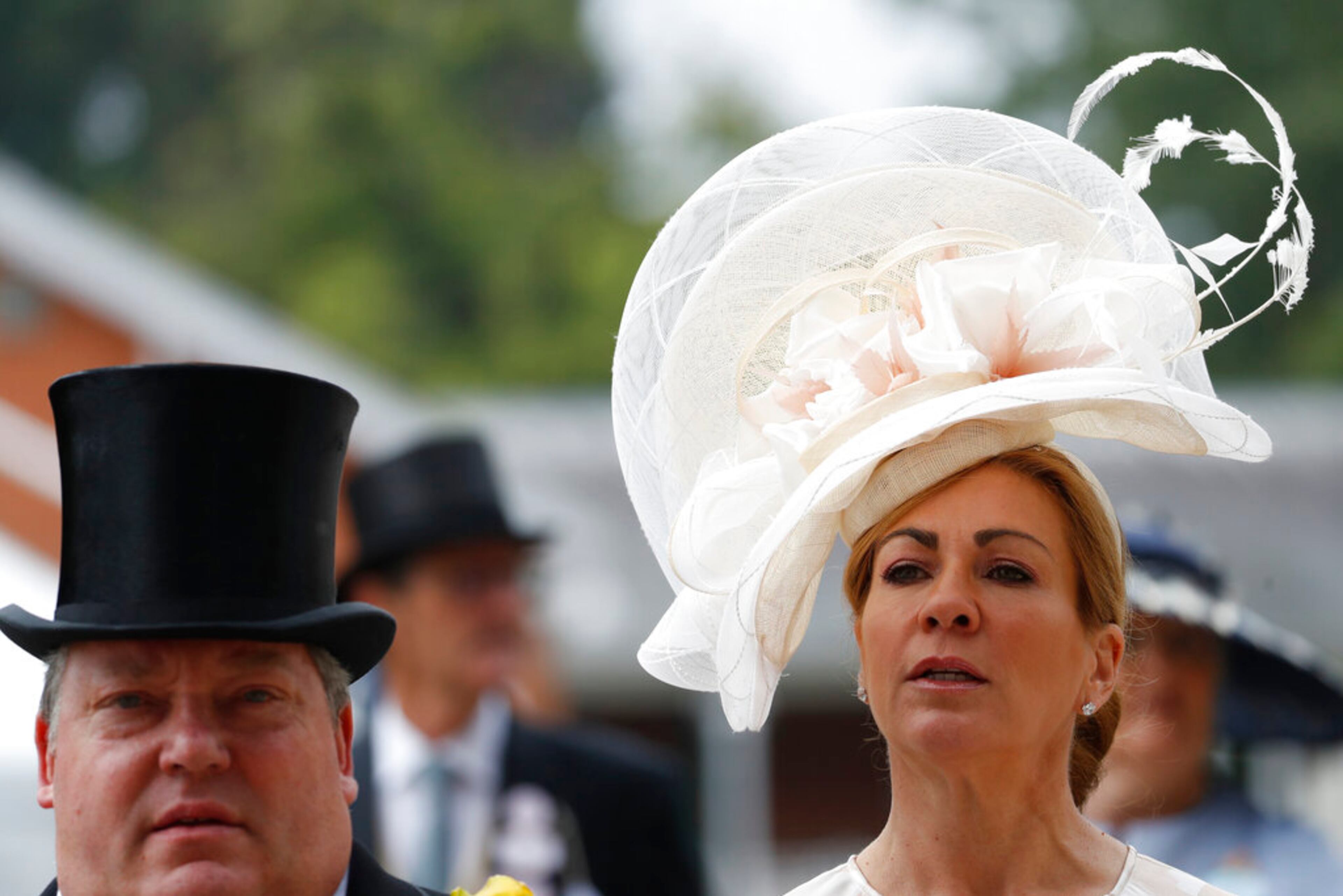 Racegoers arrive on the second day of the annual Royal Ascot horse race meeting in Ascot, England, Wednesday, June 19, 2019. (AP Photo/Alastair Grant)