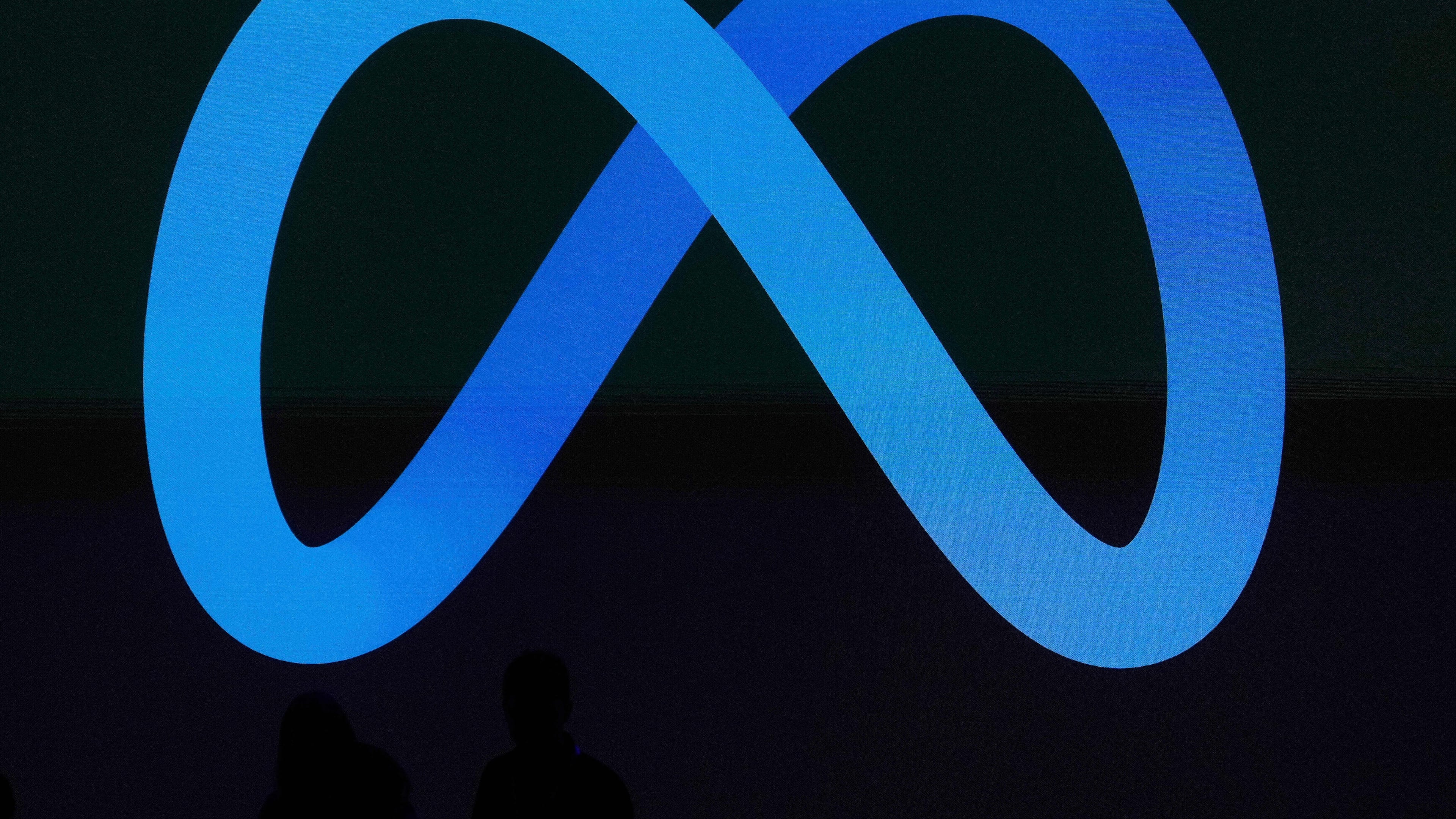 FILE - A Meta logo is shown on a video screen at LlamaCon 2025, an AI developer conference, in Menlo Park, Calif., April 29, 2025. (AP Photo/Jeff Chiu, File)