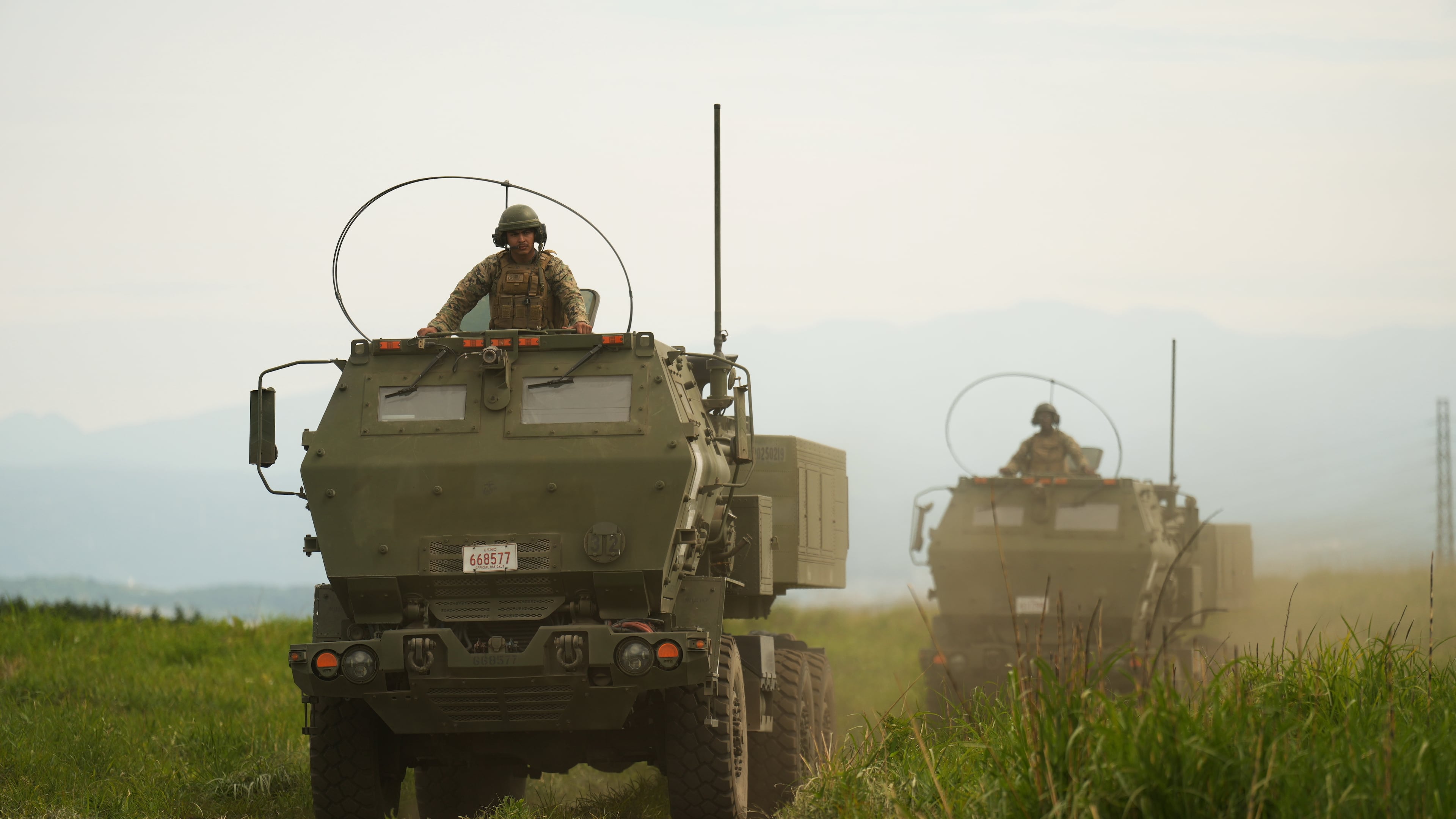 U.S. Marines appear to show the High Mobility Artillery Rocket System (HIMARS) mounted on trucks during a media tour after they conducted its live-fire training at Camp Fuji, in Gotemba, southwest of Tokyo, Wednesday, May 20, 2026. (AP Photo/Hiro Komae)
