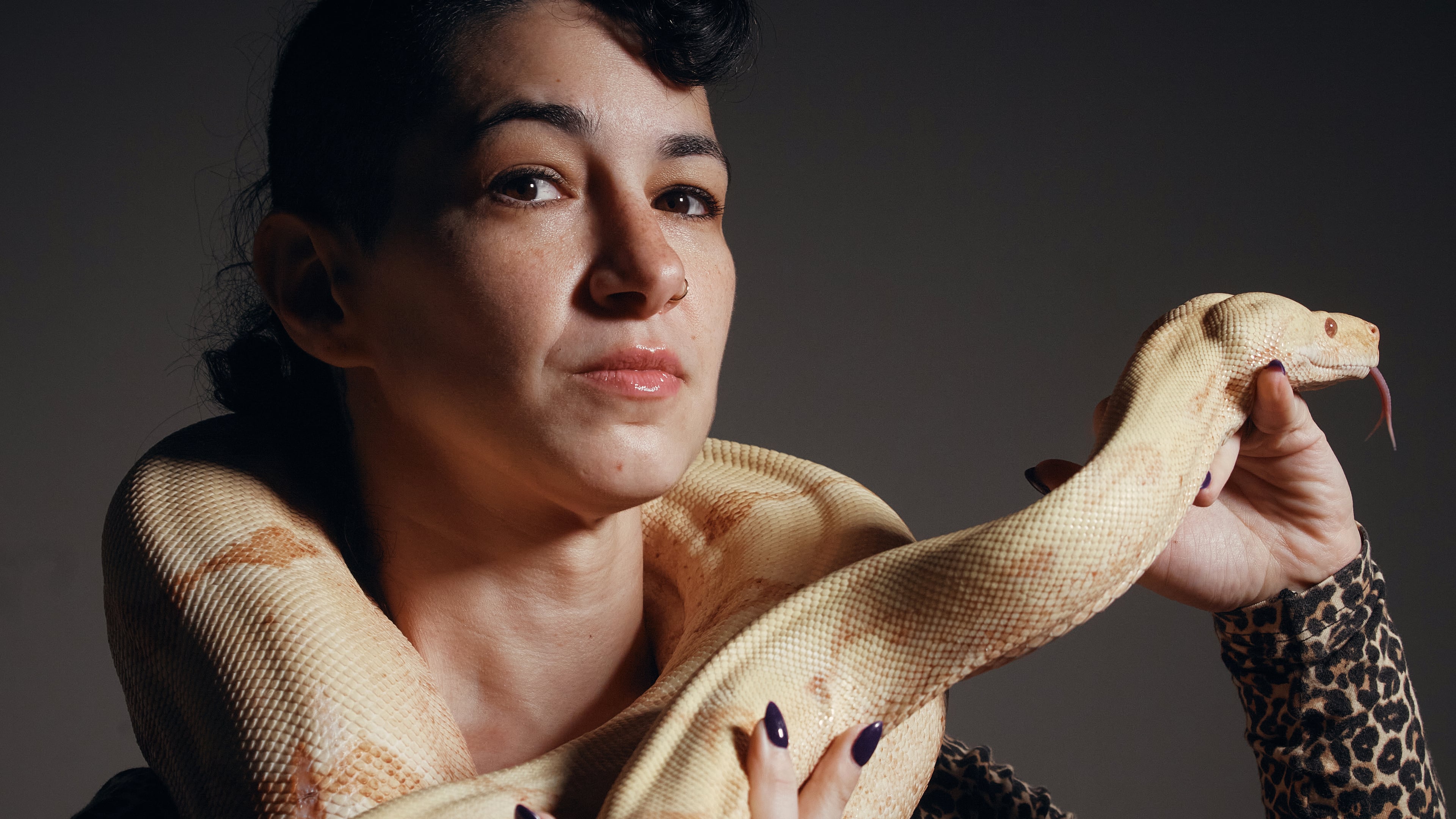Performance artist Zoe Ziegfeld who plays the part of a snake charmer poses for a portrait with a snake during auditions to select a snake for a part in an adaptation of Mozart’s “Così fan tutte," at the Metropolitan Opera in New York, Friday, Aug. 28, 2026. (AP Photo/Andres Kudacki)