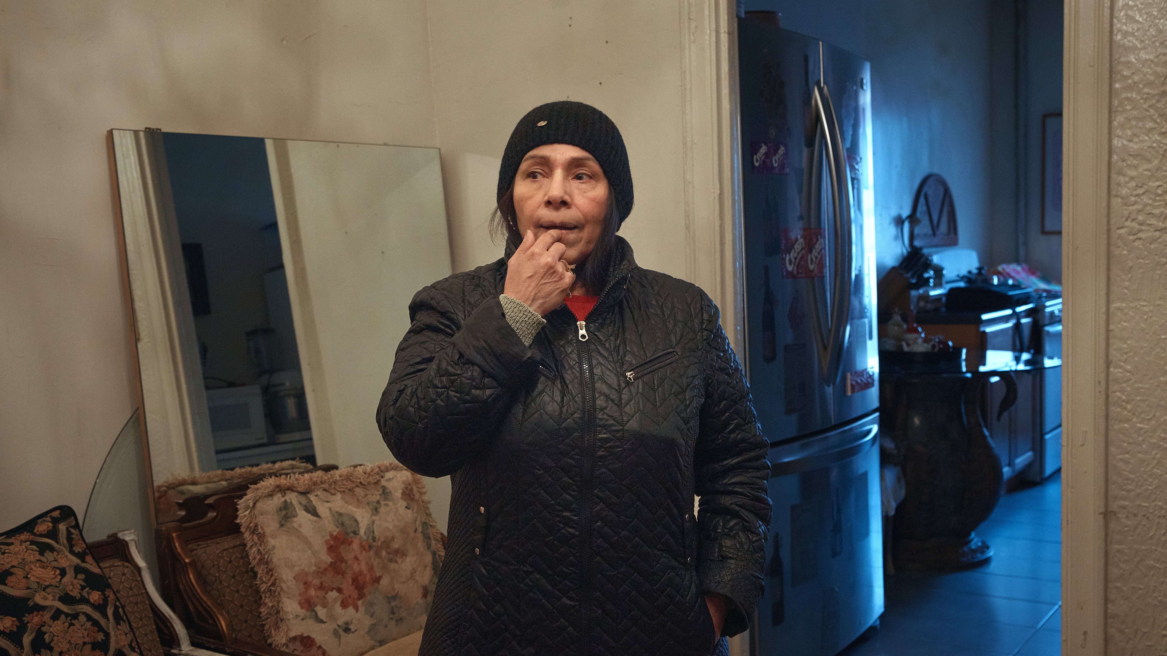 Marina Quiroz stands in her living room in a Bronx apartment building, where tenants report maintenance issues, pest infestations, Tuesday, March 17, 2026, in New York. (AP Photo/Andres Kudacki)