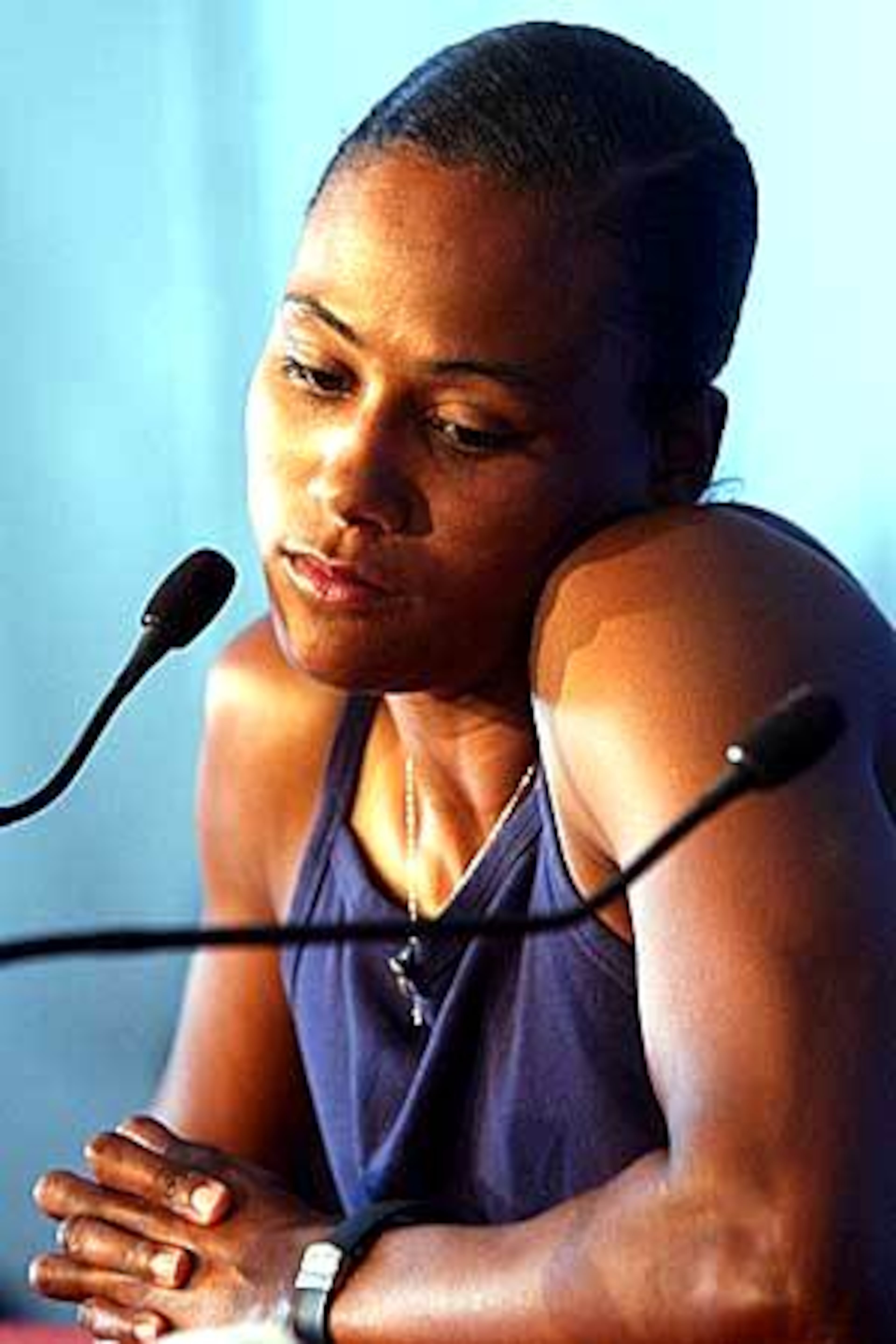 Jones pauses as she address the media to explain that she will be pulling out of the 200 meter competition to concentrate on the long jump and the relays during the Olympic Track and Field trials in Sacramento.