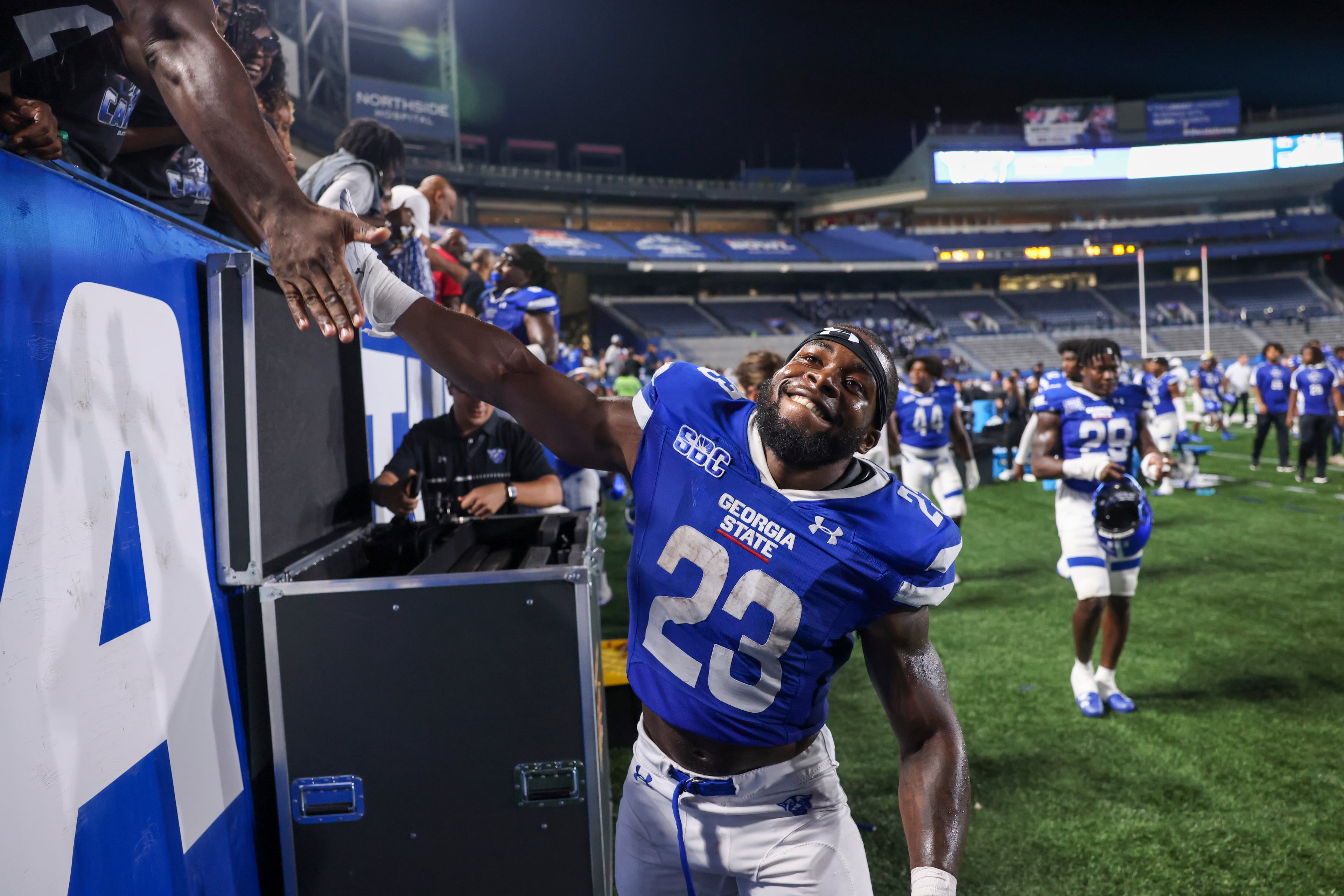 Georgia State running back Marcus Carroll (23) celebrates their win against Rhode Island at Center Parc Stadium, Thursday, August 31, 2023, in Atlanta. Carroll had a career-high 184 yards and three touchdowns. Georgia State won 42-35. (Jason Getz / Jason.Getz@ajc.com)
