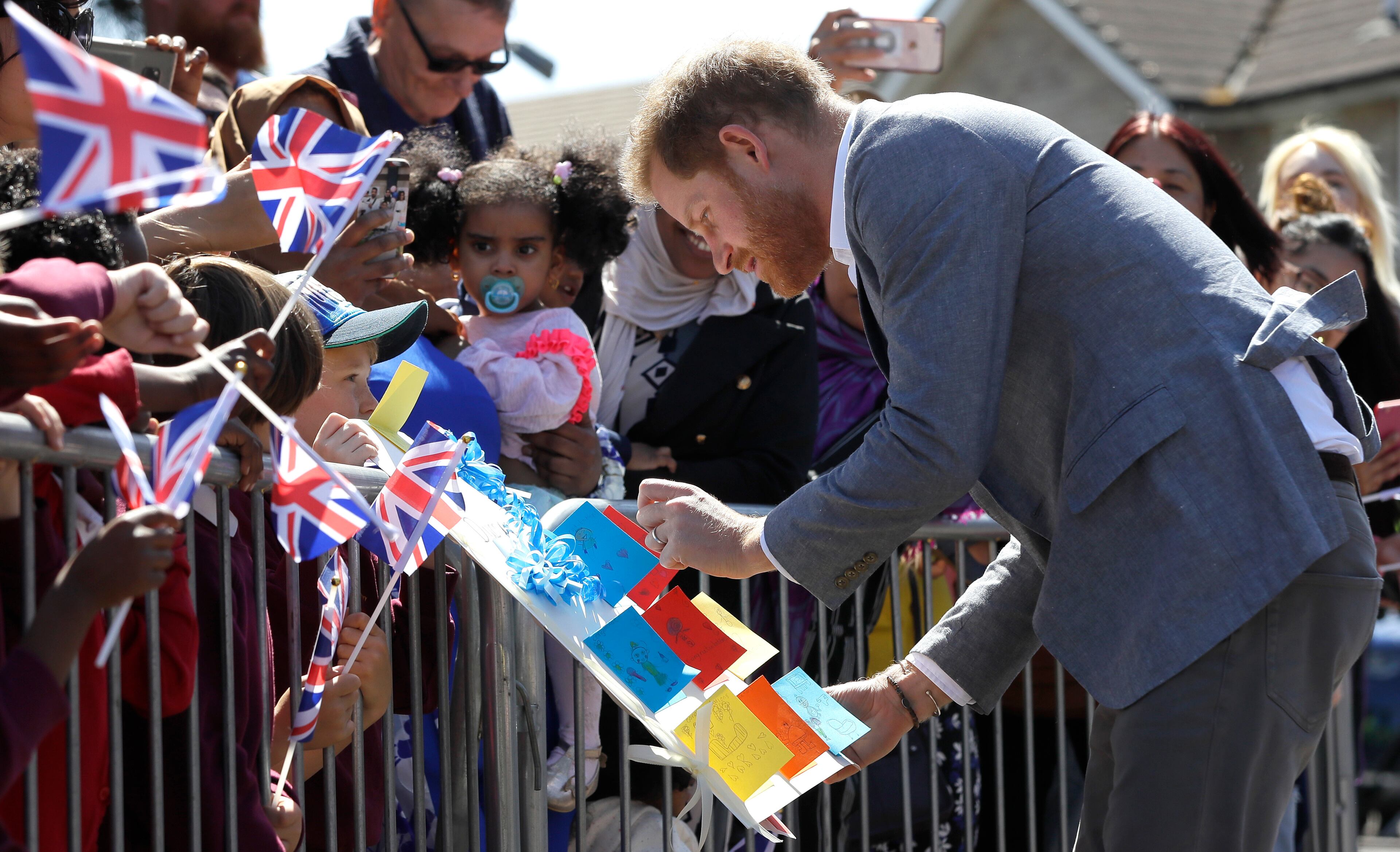 OXFORD, ENGLAND - MAY 14: Prince Harry, Duke of Sussex meets members of the public as he arrives for a visit to Barton Neighbourhood Centre on May 14, 2019 in Oxford, England. The centre is a hub for local residents which houses a doctor's surgery, food bank, cafe and youth club. (Photo by Kirsty Wigglesworth - WPA Pool/Getty Images)
