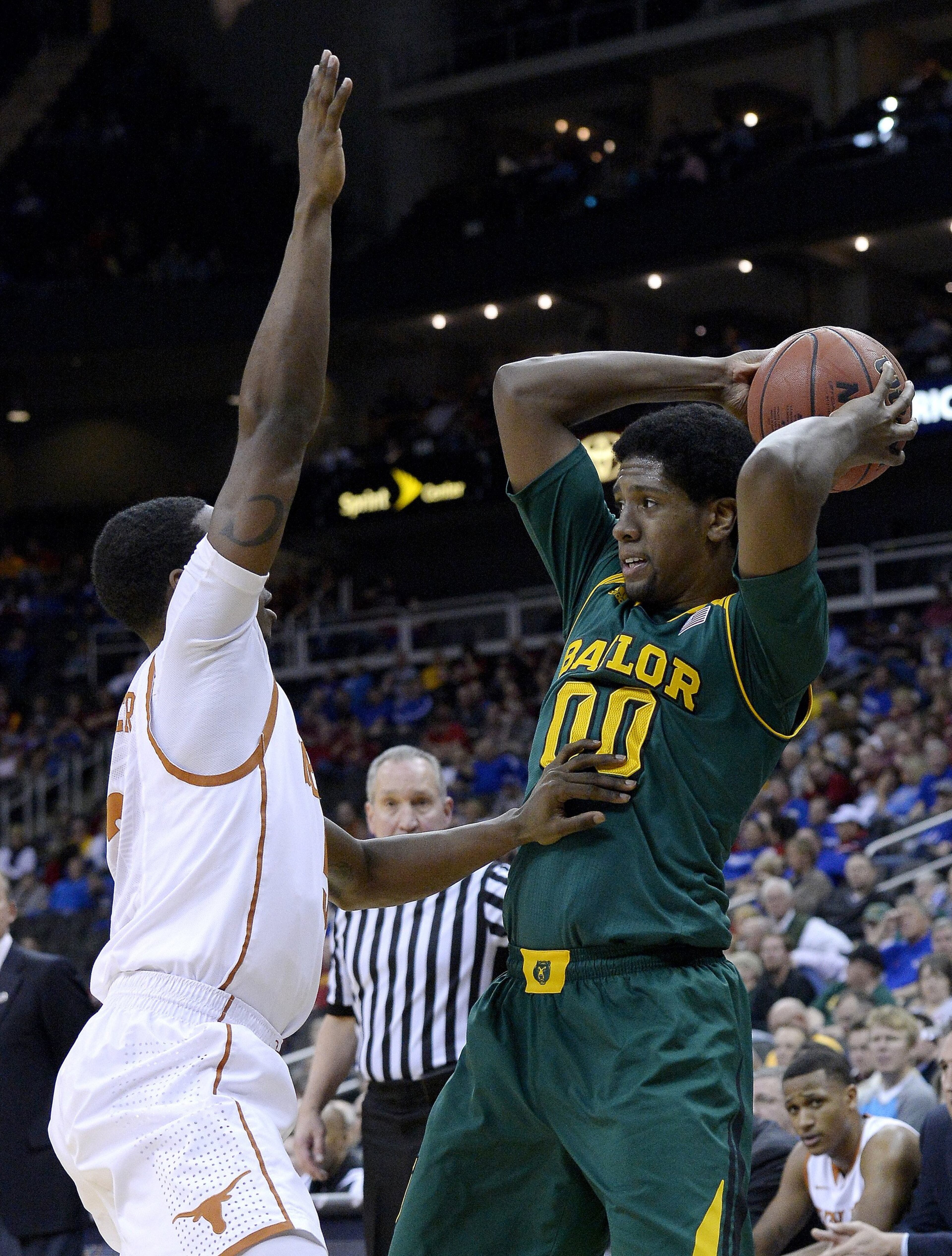 Baylor's Royce O'Neale (00) looks to pass over Texas' Damarcus Croaker (5) during the Big 12 Tournament semifinals at the Sprint Center in Kansas City, Mo., on Friday, March 14, 2014.