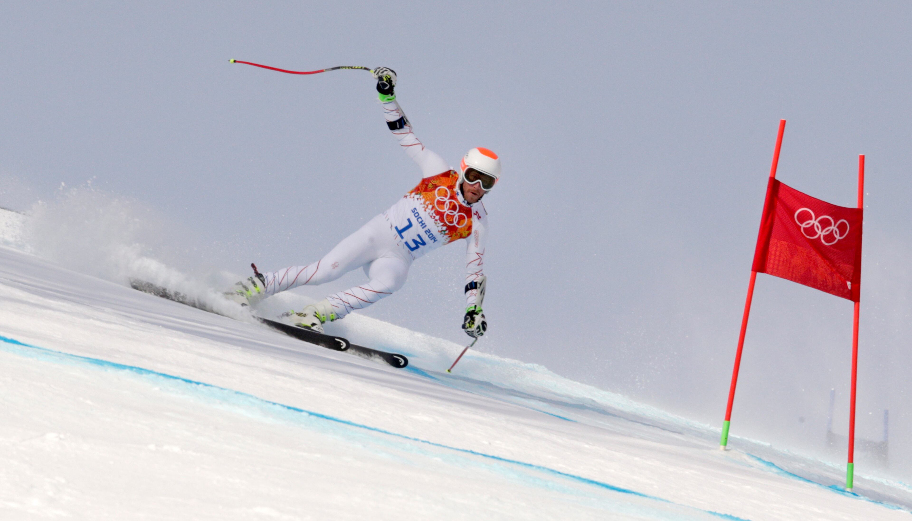 Joint bronze medal winner Bode Miller of the United States passes a gate in the men's super-G at the Sochi 2014 Winter Olympics, Sunday, Feb. 16, 2014, in Krasnaya Polyana, Russia. (AP Photo/Charles Krupa)