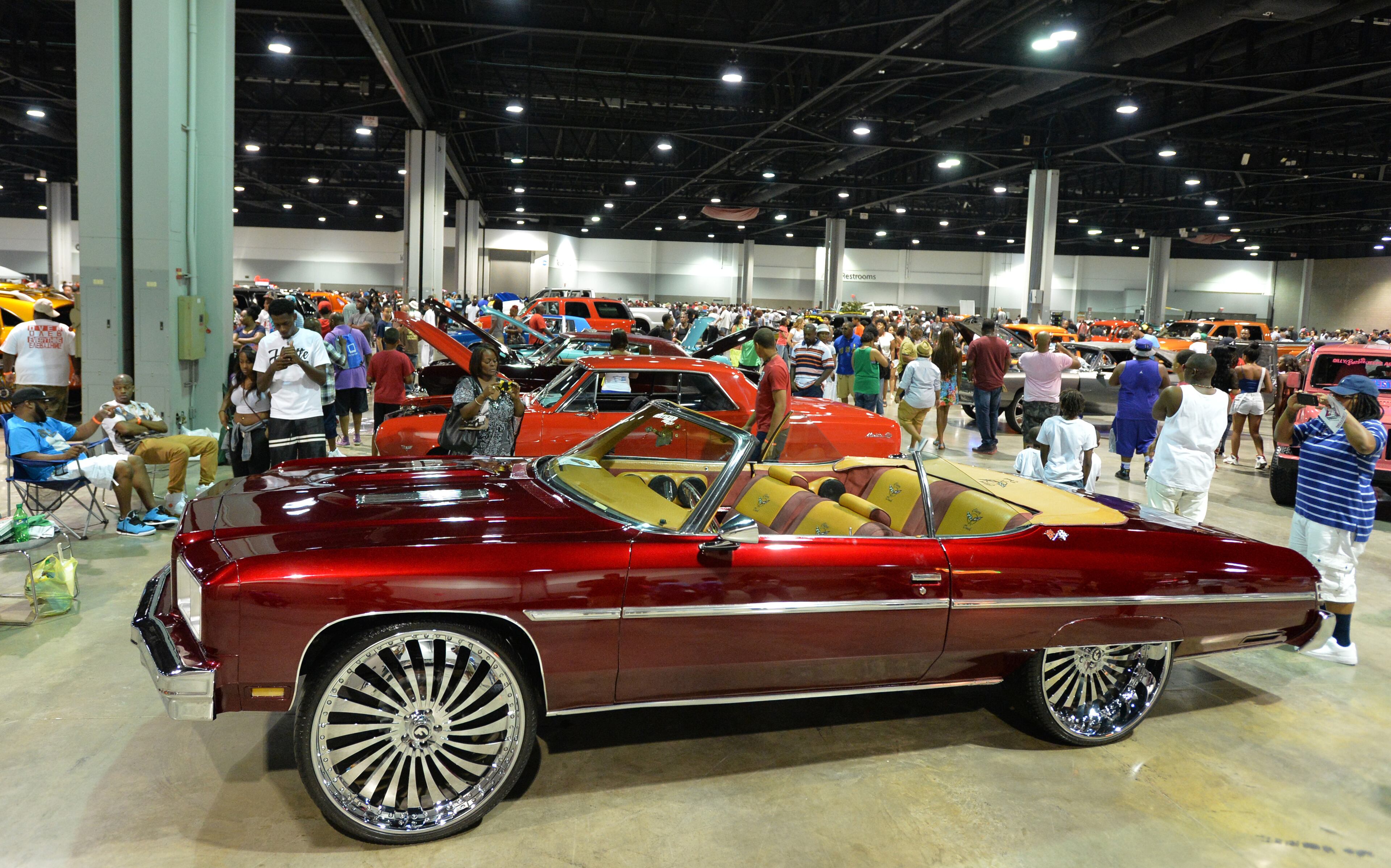 Custom vehicles lined-up for event-goers during The 2014 V-103/WAOK Car & Bike Show at the Georgia World Congress Center on Saturday, July 12, 2014.
