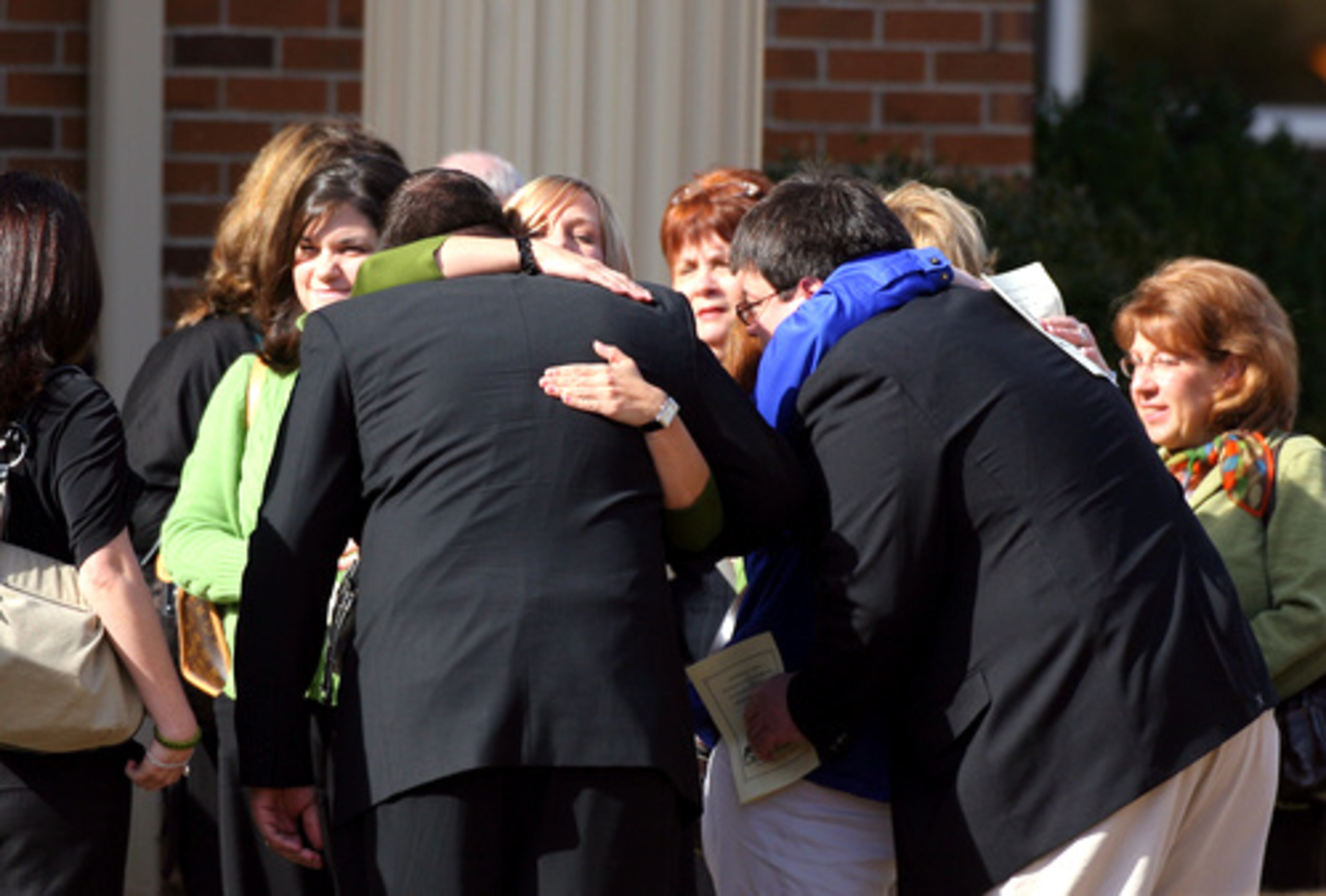 People gather outside Center Presbyterian Church in Athens before the start of Friday's memorial service.