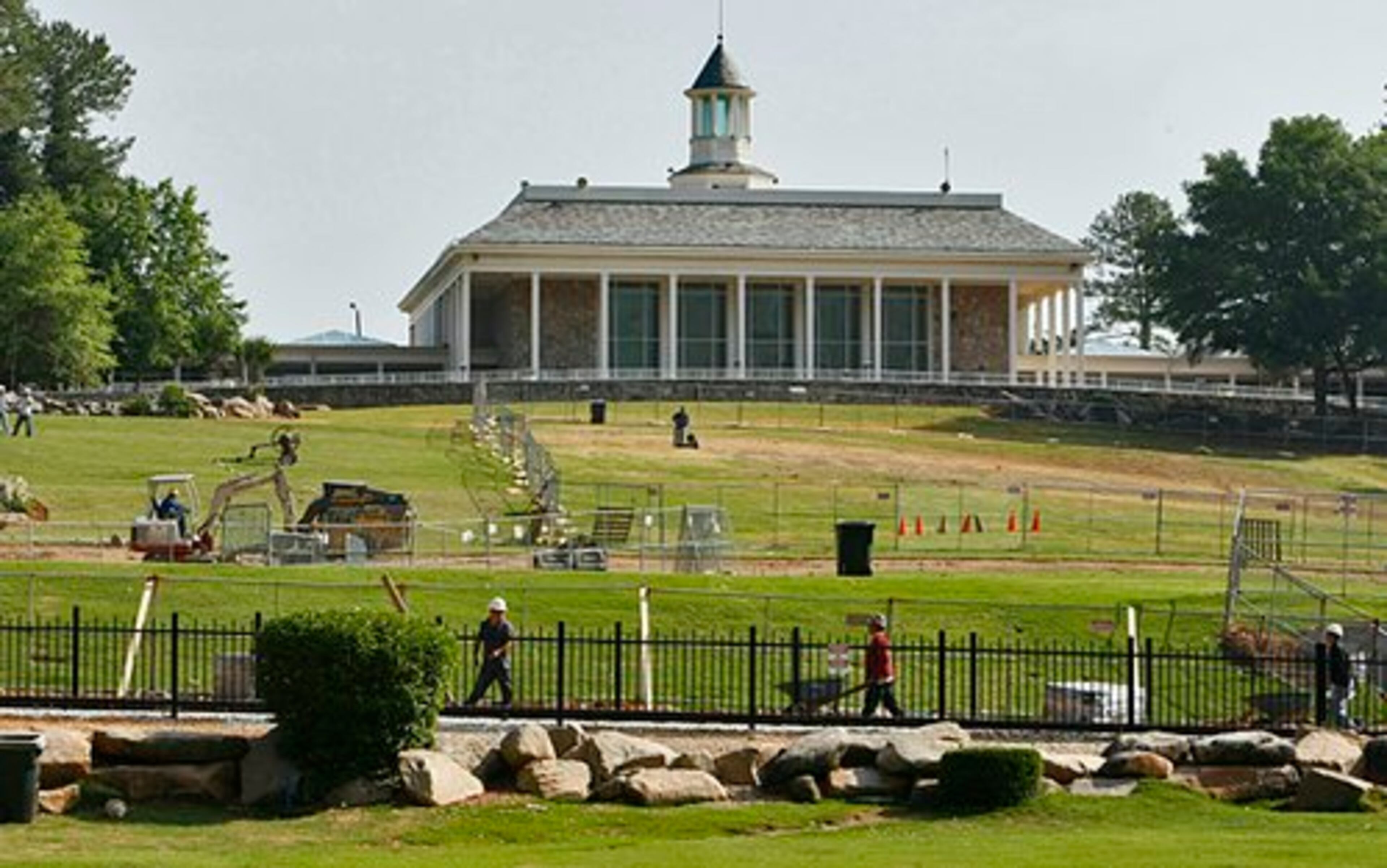 Work continues on the lawn, with Memorial Hall in the background.