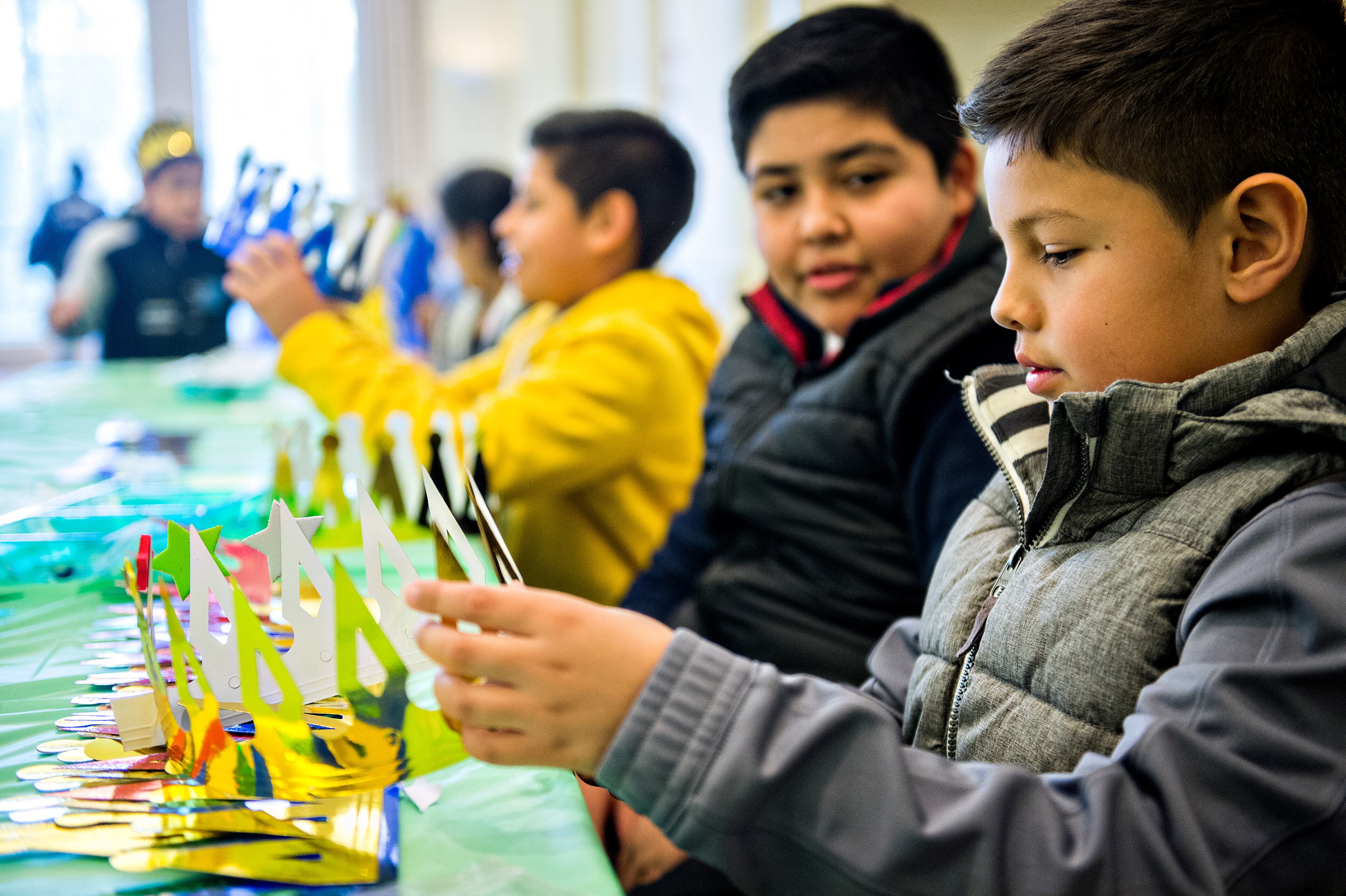 January 10, 2016 Atlanta - Angel Gutierrez (right) decorates a crown during the Dia de los Reyes, or Three Kings Day, celebration at the Atlanta History Center on Sunday, January 10, 2016. JONATHAN PHILLIPS / SPECIAL