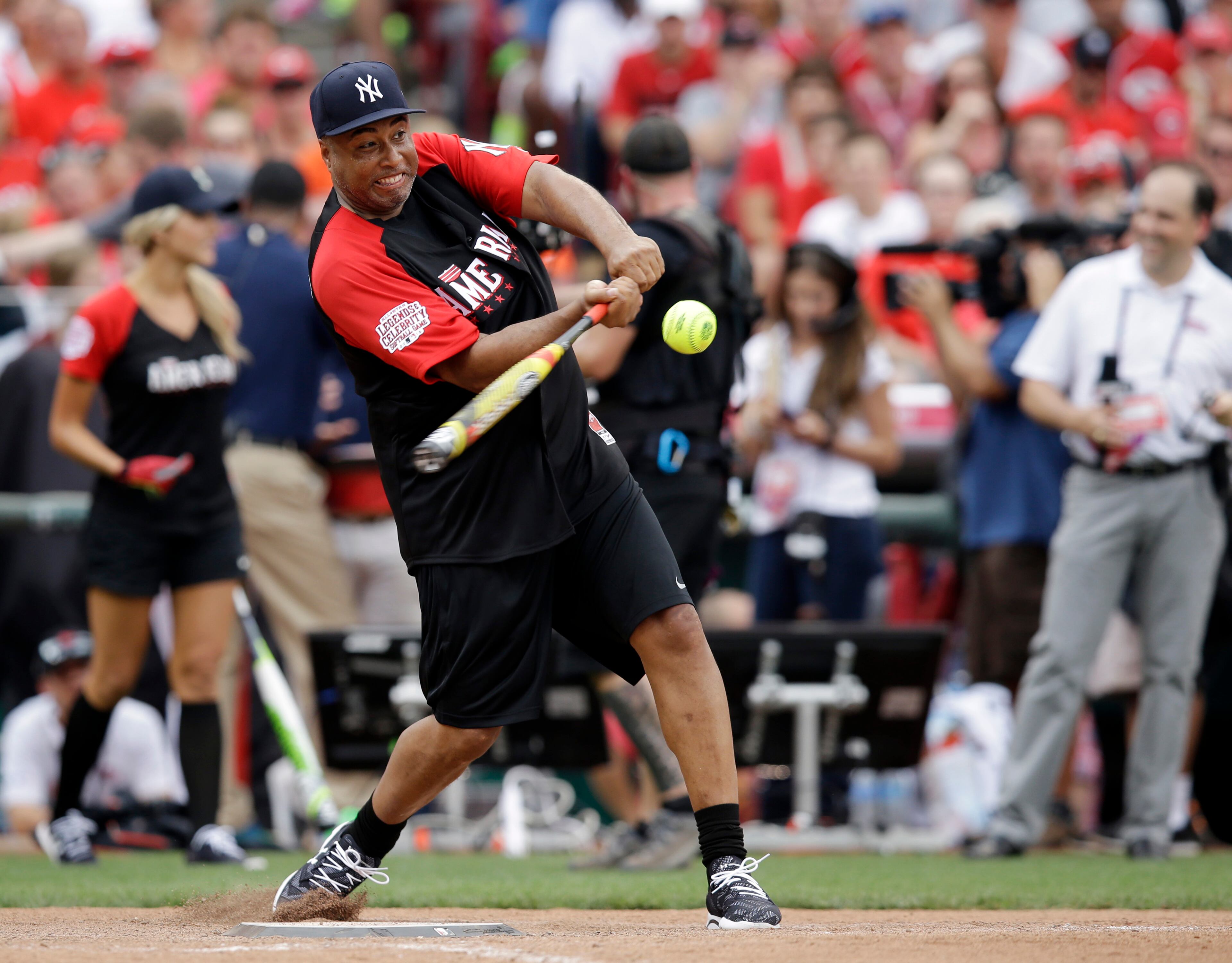 Bernie Williams hits during the All-Star Legends & Celebrity Softball game, Sunday, July 12, 2015, in Cincinnati. (AP Photo/John Minchillo)