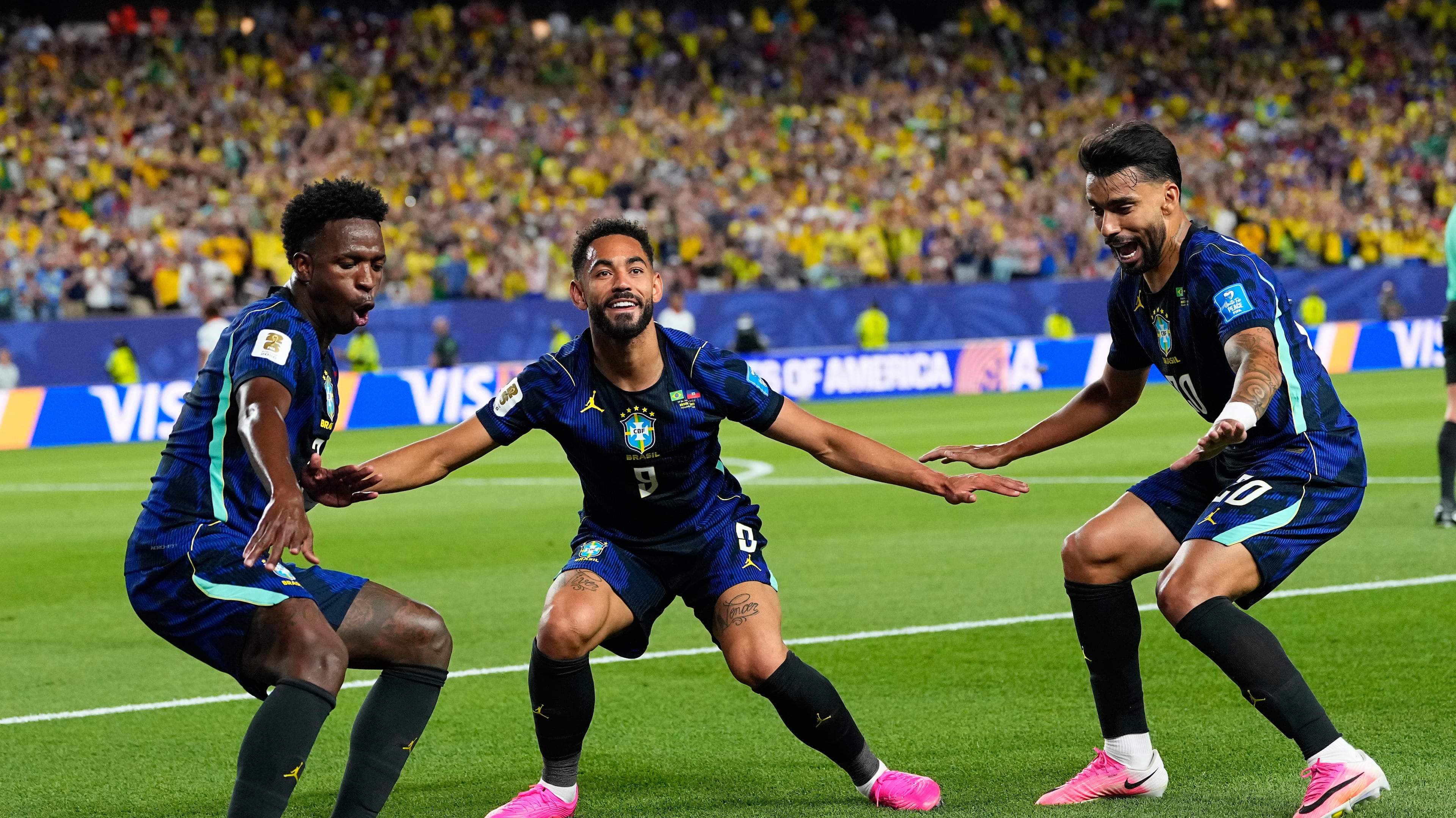 Brazil's Matheus Cunha (9) celebrates after scoring his side's second goal with Brazil's Vinicius Junior (7) and Lucas Paqueta (20) during the World Cup Group C soccer match between Brazil and Haiti in Philadelphia, Friday, June 19, 2026. (AP Photo/Petr David Josek)