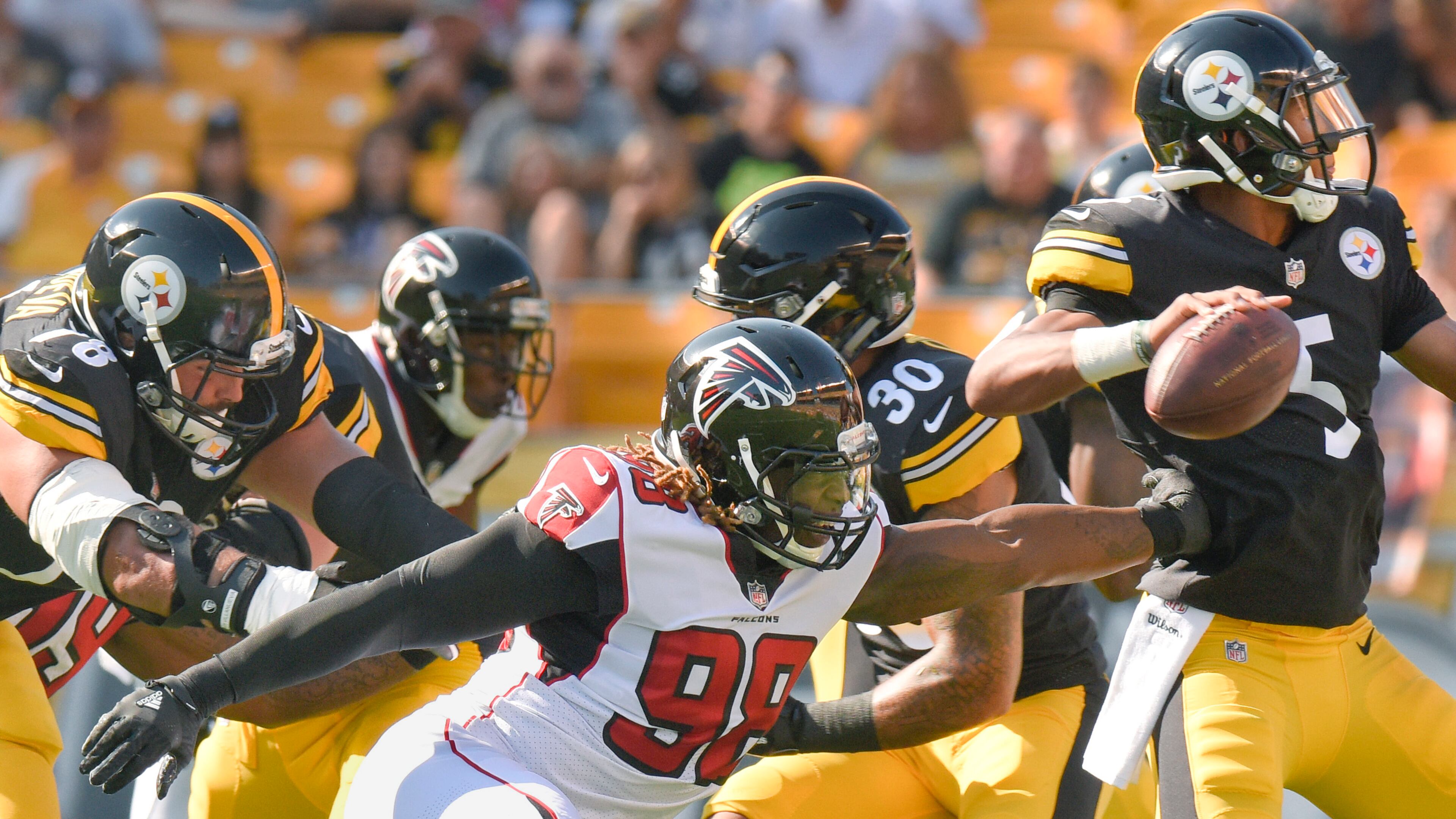 Atlanta Falcons defensive end Takkarist McKinley (98) reaches for Pittsburgh Steelers quarterback Joshua Dobbs (5) in their exhibition game, Sunday, Aug. 20, 2017, in Pittsburgh. (AP Photo/Don Wright)
