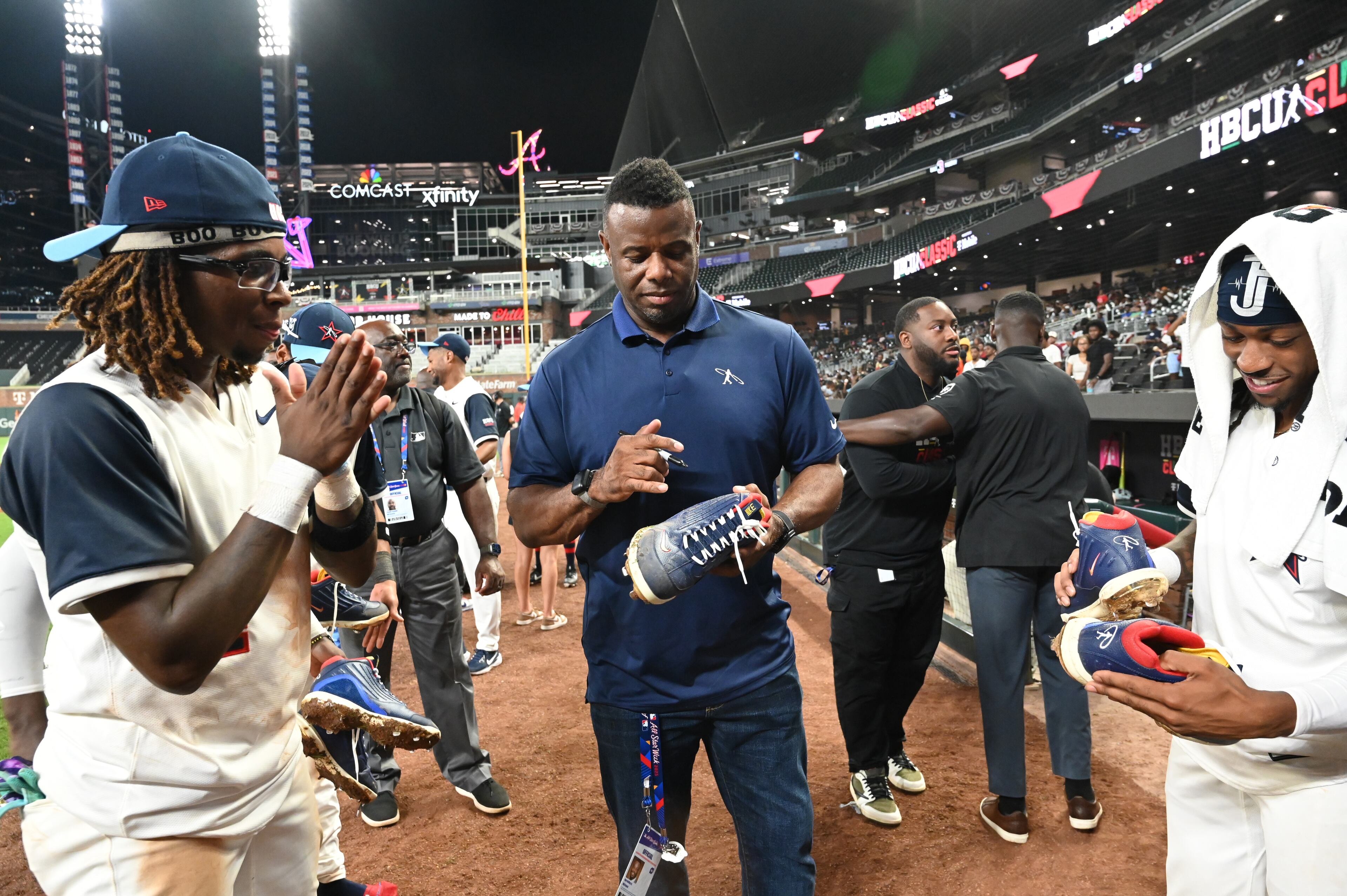 Baseball Hall of Famer Ken Griffey Jr. signs autographs during the HBCU Swingman Classic at Truist Park on Tuesday, July 11, 2025, in Atlanta. By the time night fell, players were chatting with Griffey — one of the greatest legends of all — about their swings. (Hyosub Shin/AJC)