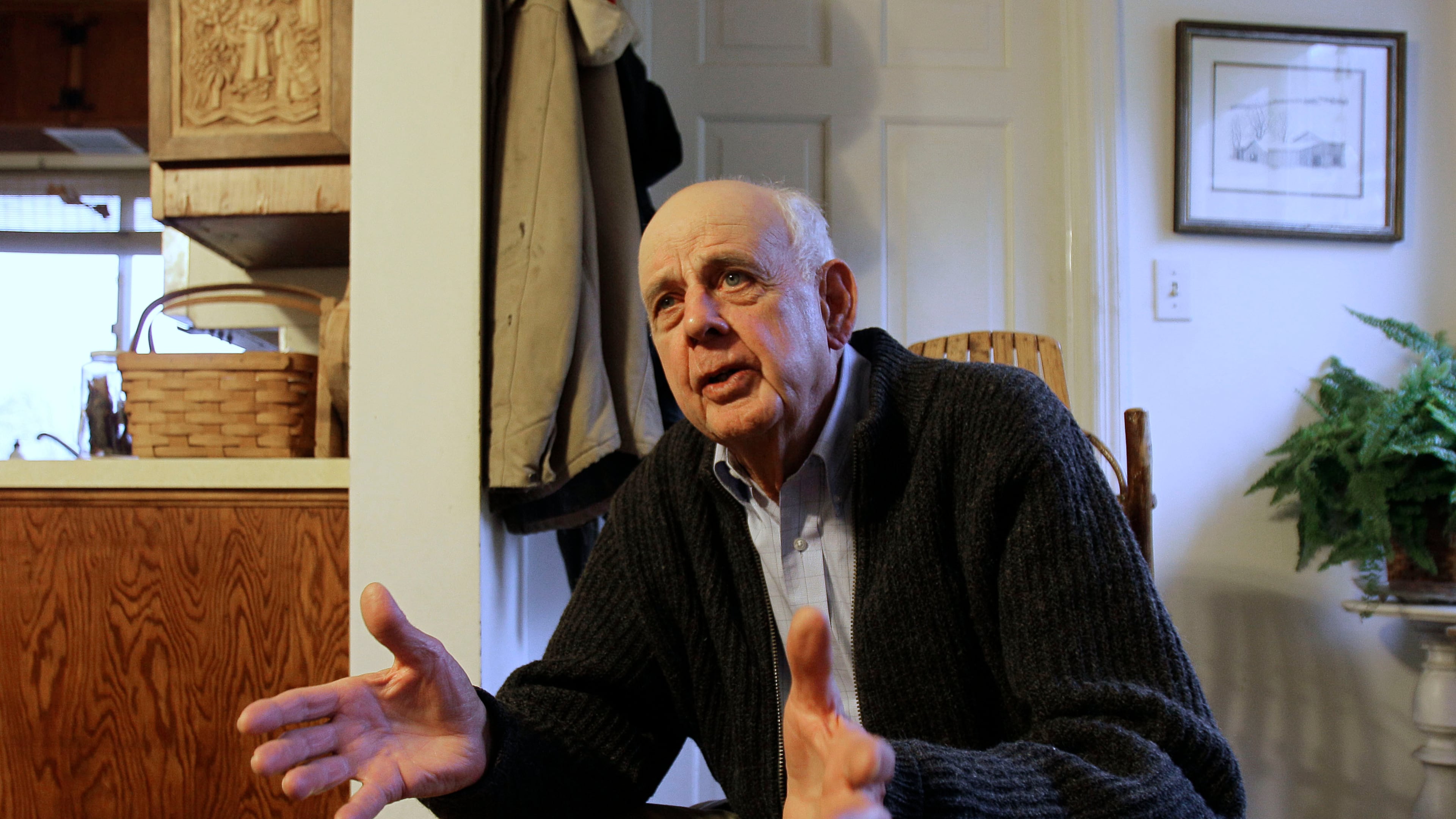 FILE - Wendell Berry talks with a reporter at his home in Port Royal, Ky., March 10, 2011. (AP Photo/Ed Reinke, File)