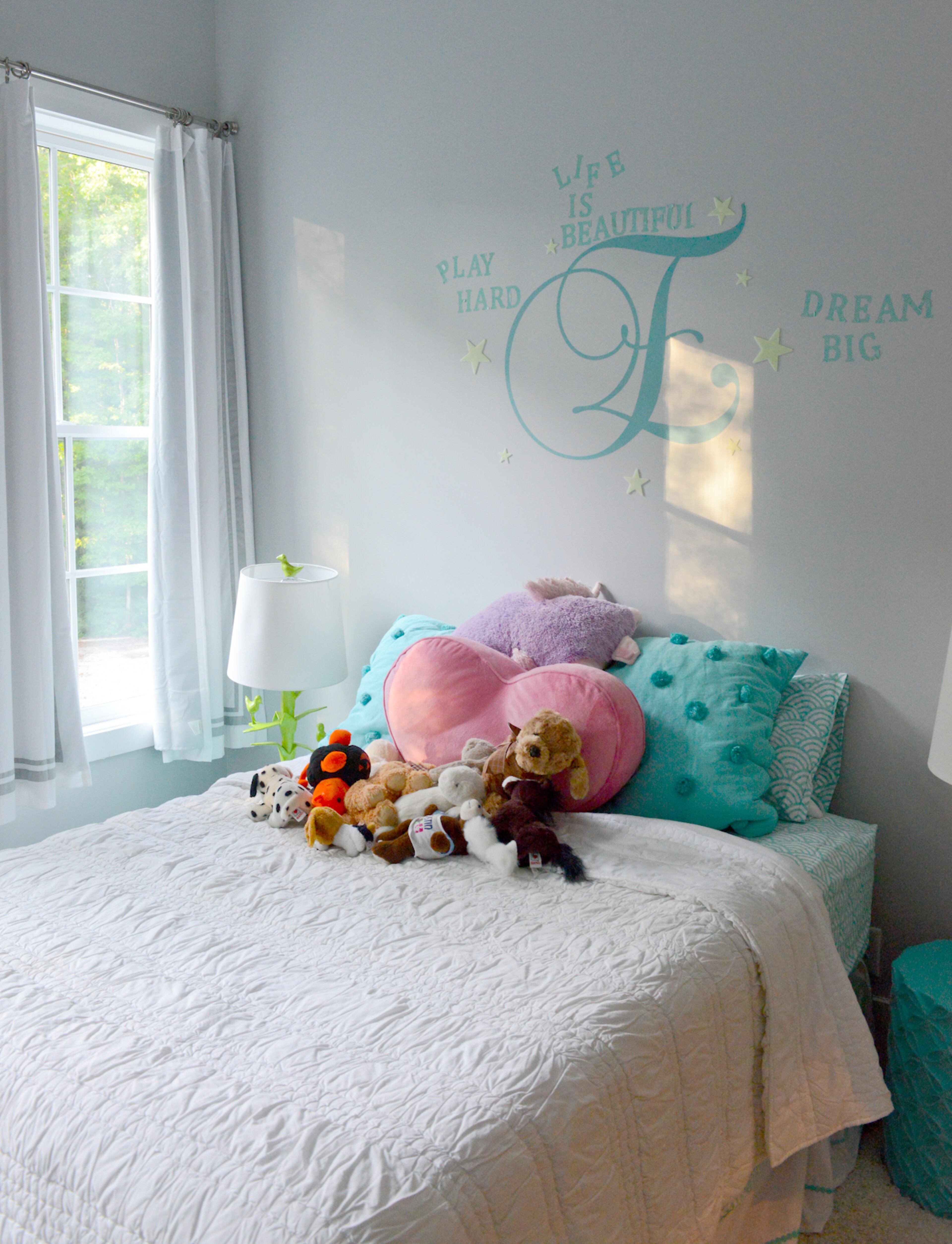 Ten-year-old Ella Bratti's bedroom is her own inspirational creation. Mom Nadine Bratti agreed to let Ella design it herself, using gray tones and pops of color.