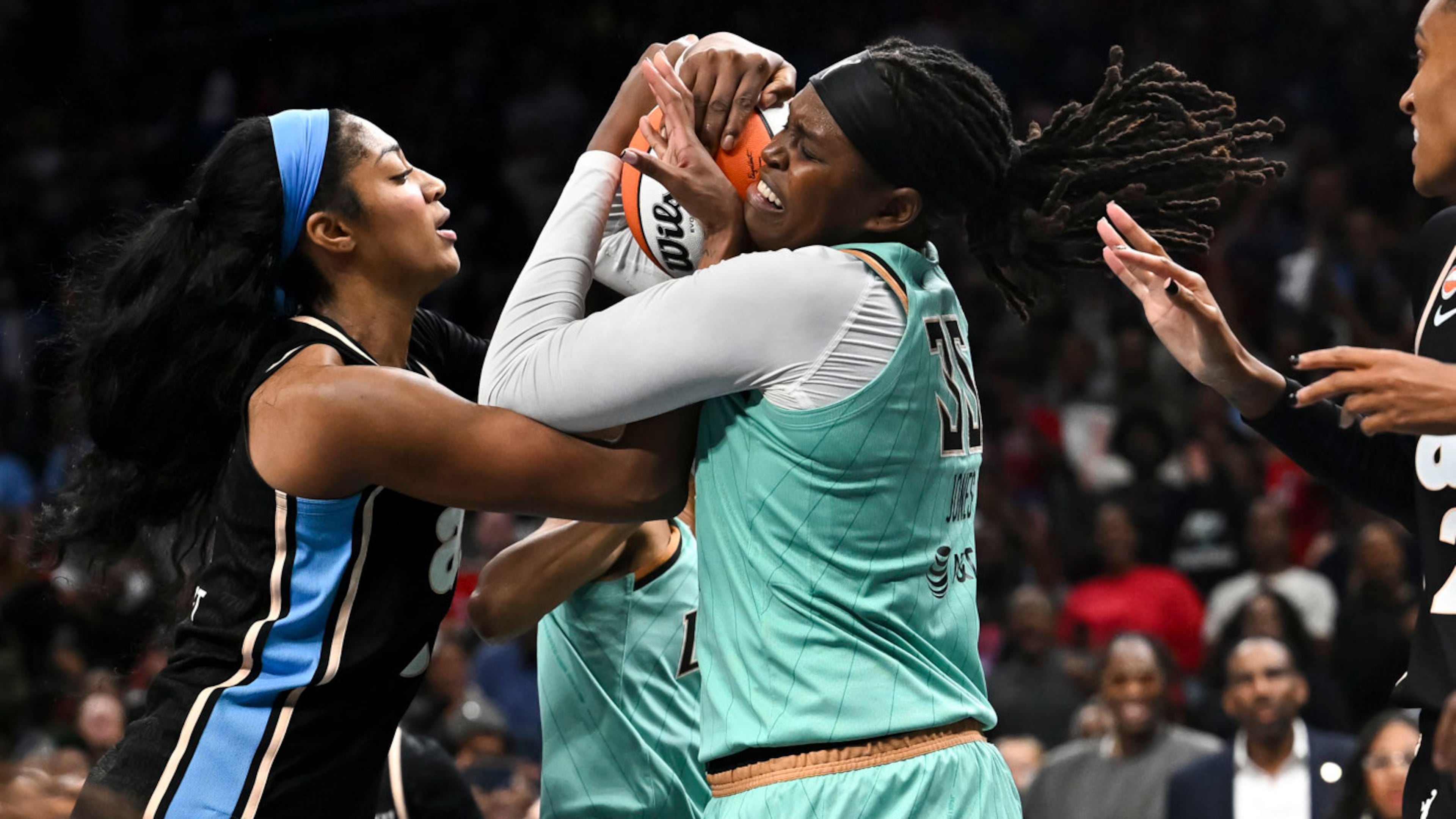 Atlanta Dream forward Angel Reese (5) and New York Liberty center Jonquel Jones (35) fight for a rebound during the second half in Game 2 of the WNBA basketball semifinals, Wednesday, Oct. 7, 2026, in Atlanta. (AP Photo/Daniel Varnado)