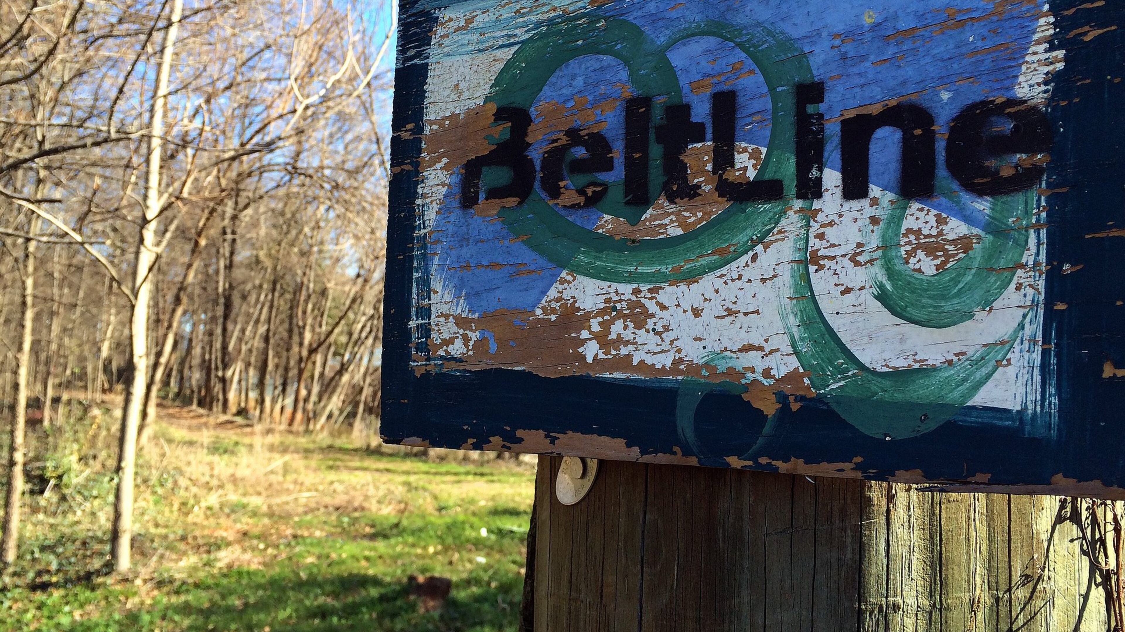 This painted sign sits on the Beltline’s Westside Trail near Lena Street in southwest Atlanta. BEN GRAY / BGRAY@AJC.COM