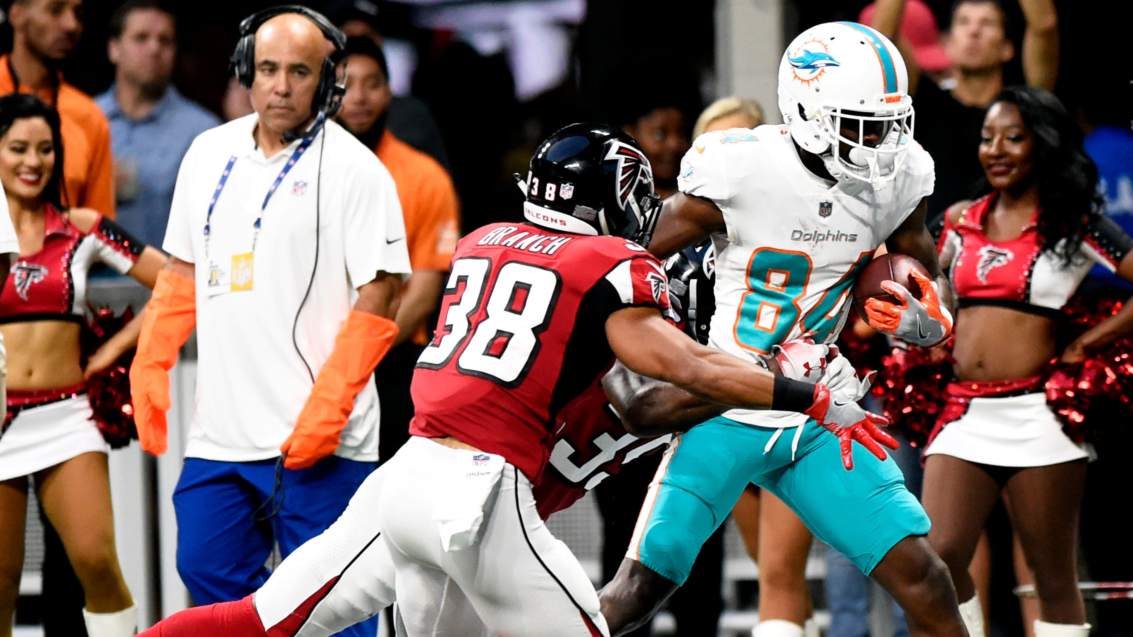 Atlanta Falcons Marcelis Branch (38) and Deante Burton (39), left to right, run to tackle Miami Dolphins Isaiah Ford (84) in an NFL preseason game on Thursday, August 30, in Atlanta. Jenna Eason / Jenna.Eason@coxinc.com