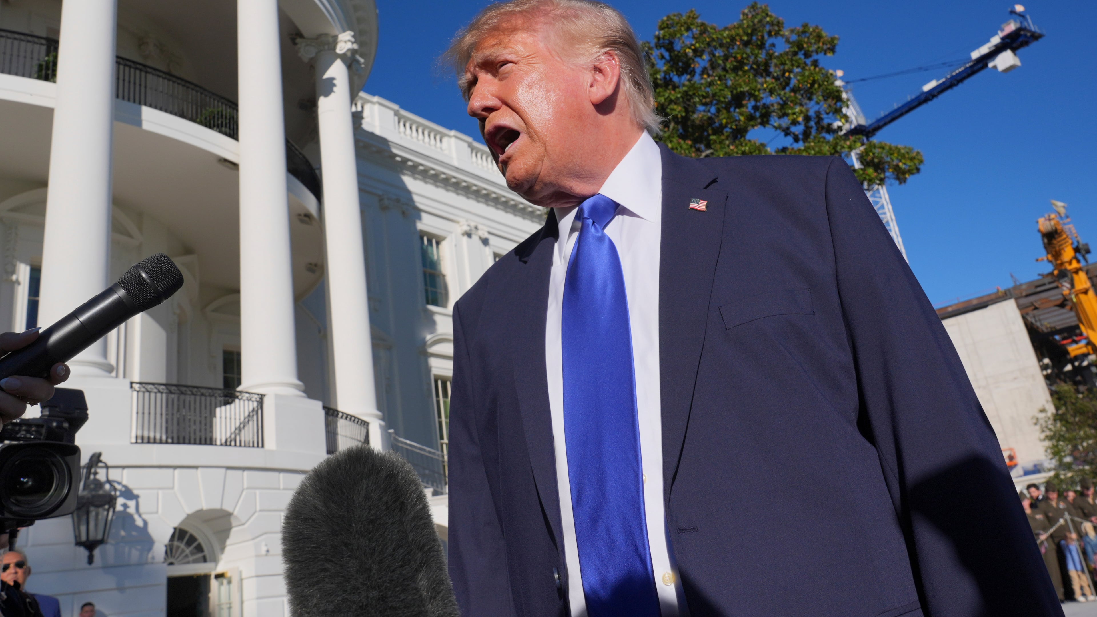 President Donald Trump speaks to reporters before walking to board Marine One on the South Lawn of the White House in Washington, Thursday, Oct. 22, 2026. (AP Photo/J. Scott Applewhite)