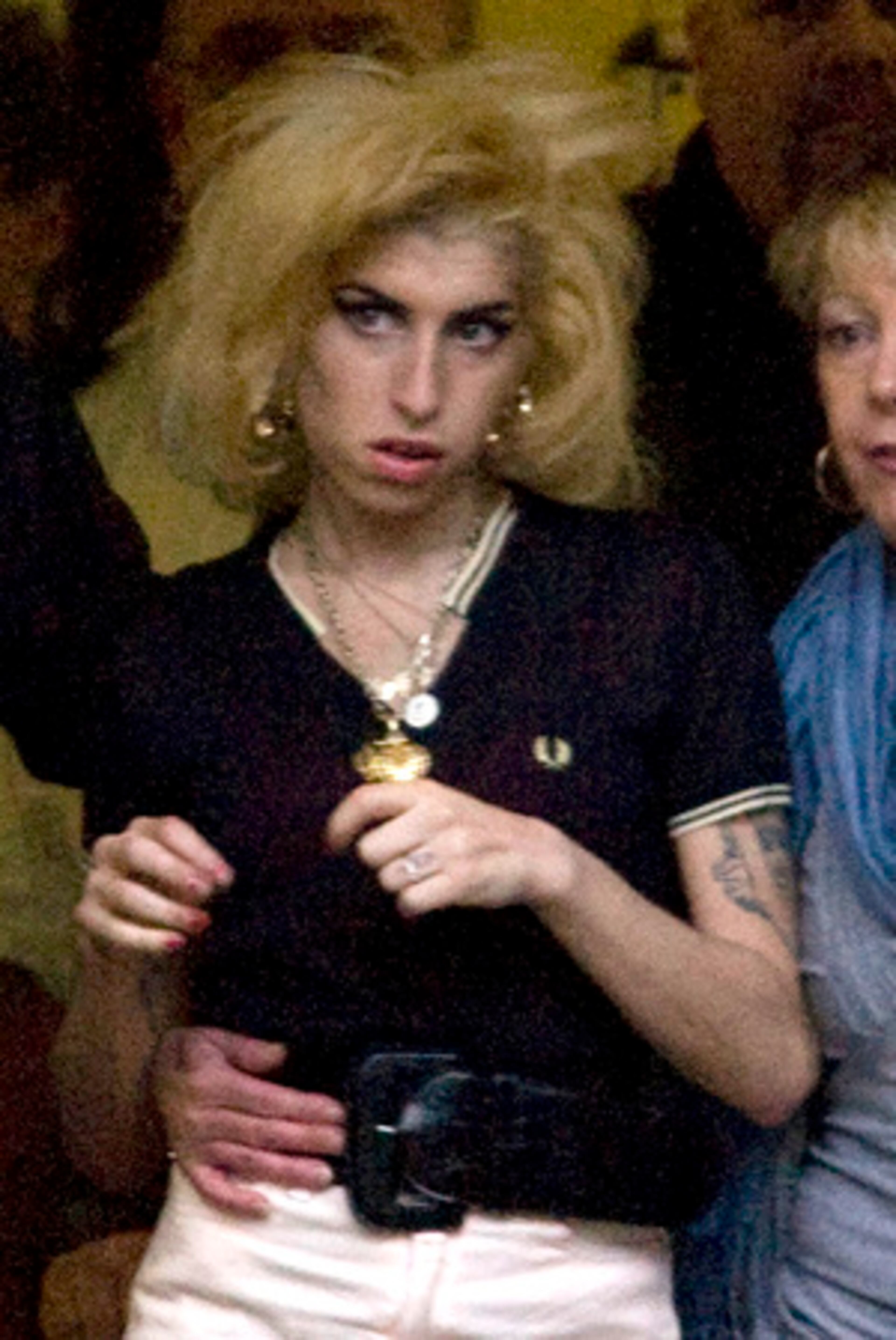Just when you thought Amy Winehouse couldn't look crazier -- remember when she was photographed wandering outside her London home wearing a bra and jeans, with no shoes? -- she shows up at her husband's court hearing as a blonde.