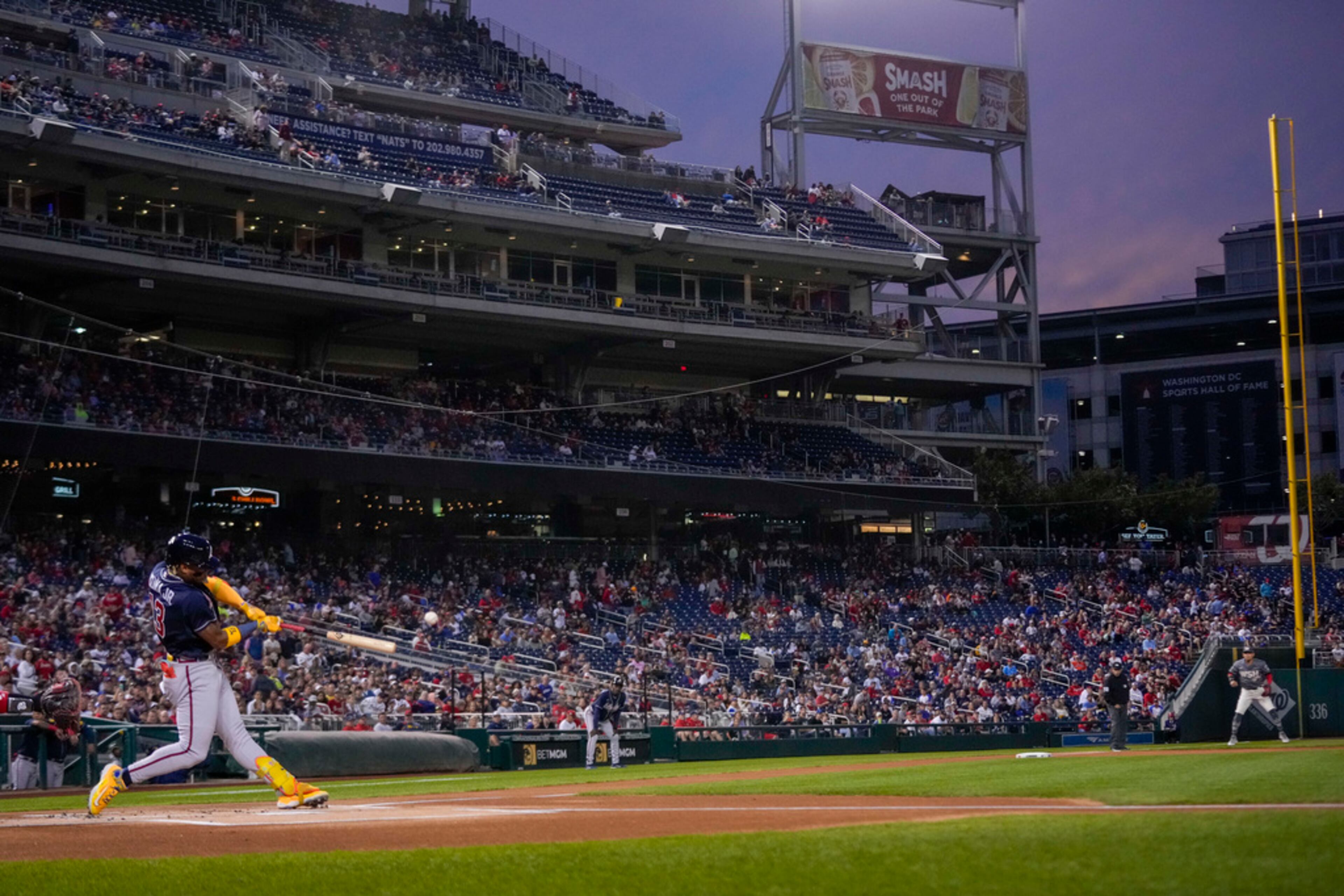 Atlanta Braves' Ronald Acuna Jr. hits a solo home run during the first inning of a baseball game against the Washington Nationals at Nationals Park, Friday, Sept. 22, 2023, in Washington. With the hit, Acuna became the fifth player in MLB history with 40 home runs and 40 stolen bases in a season. (AP Photo/Andrew Harnik)