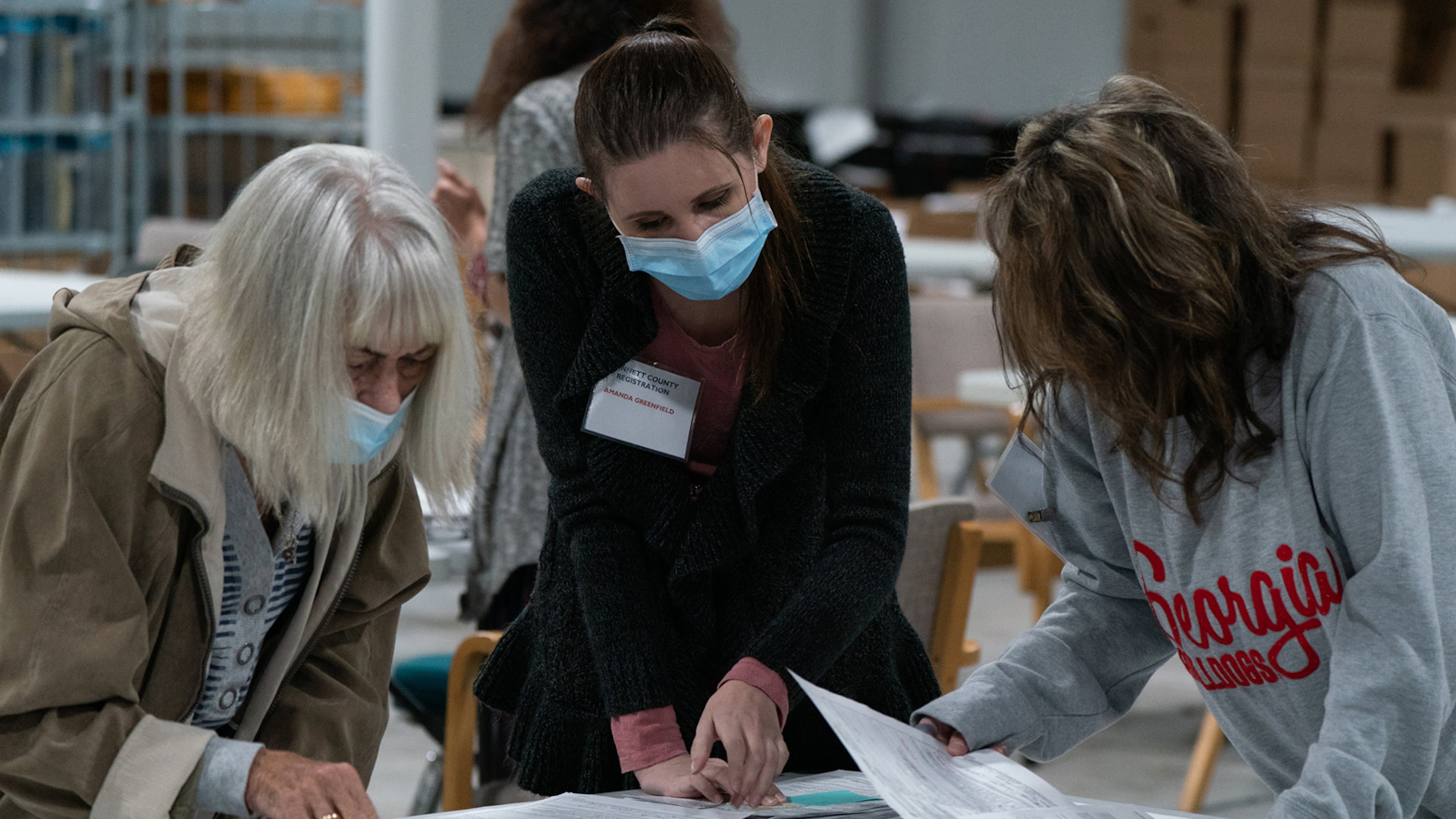 Election personnel sort absentee ballot applications at the Gwinnett County Board of Voter Registrations and Elections offices on Nov. 7, 2020, in Lawrenceville. (Elijah Nouvelage/Getty Images/TNS)