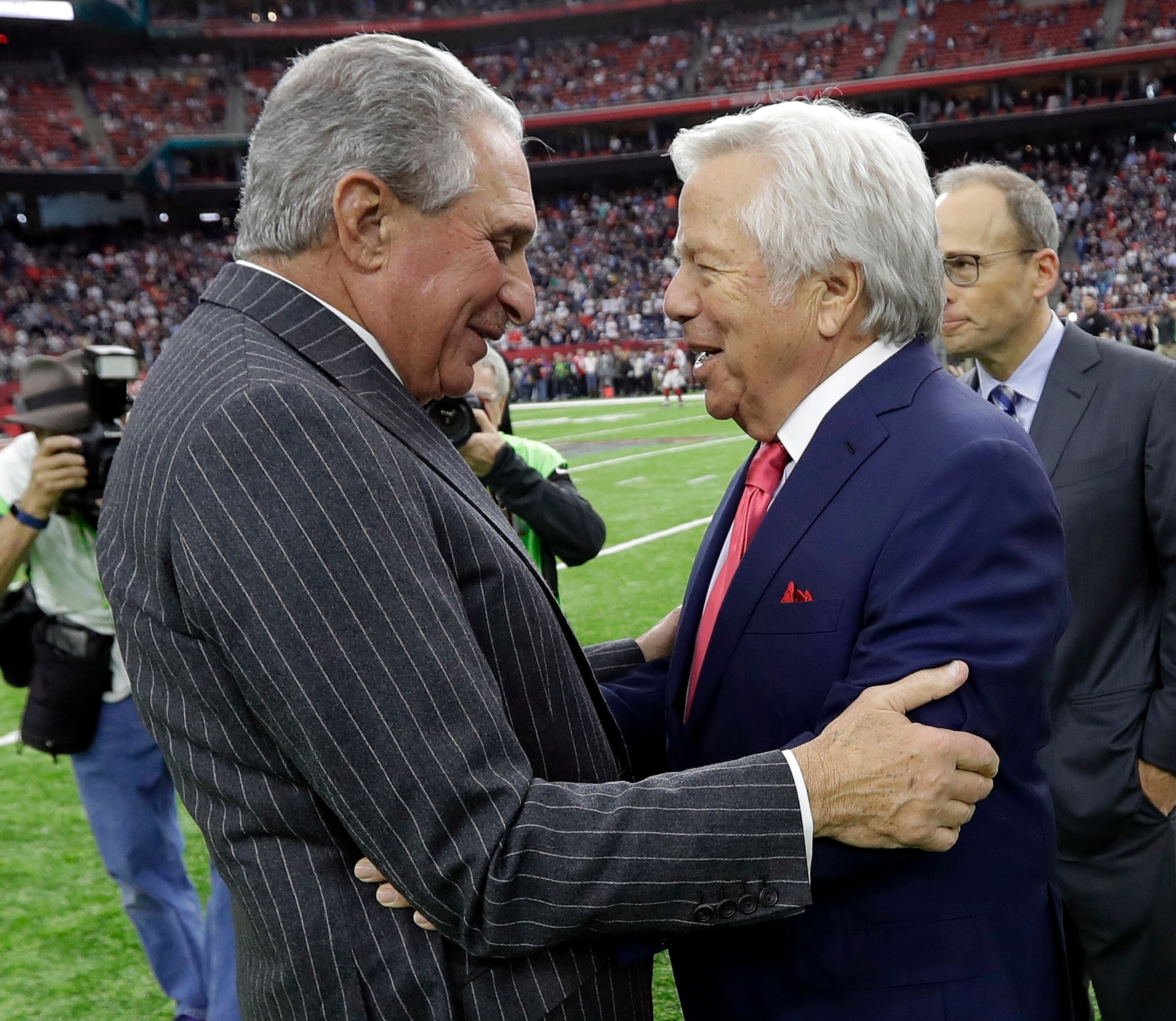 New England Patriots owner Robert Kraft, right, greets Atlanta Falcons owner Arthur Blank before the NFL Super Bowl 51 football game Sunday, Feb. 5, 2017, in Houston. (AP Photo/David J. Phillip)