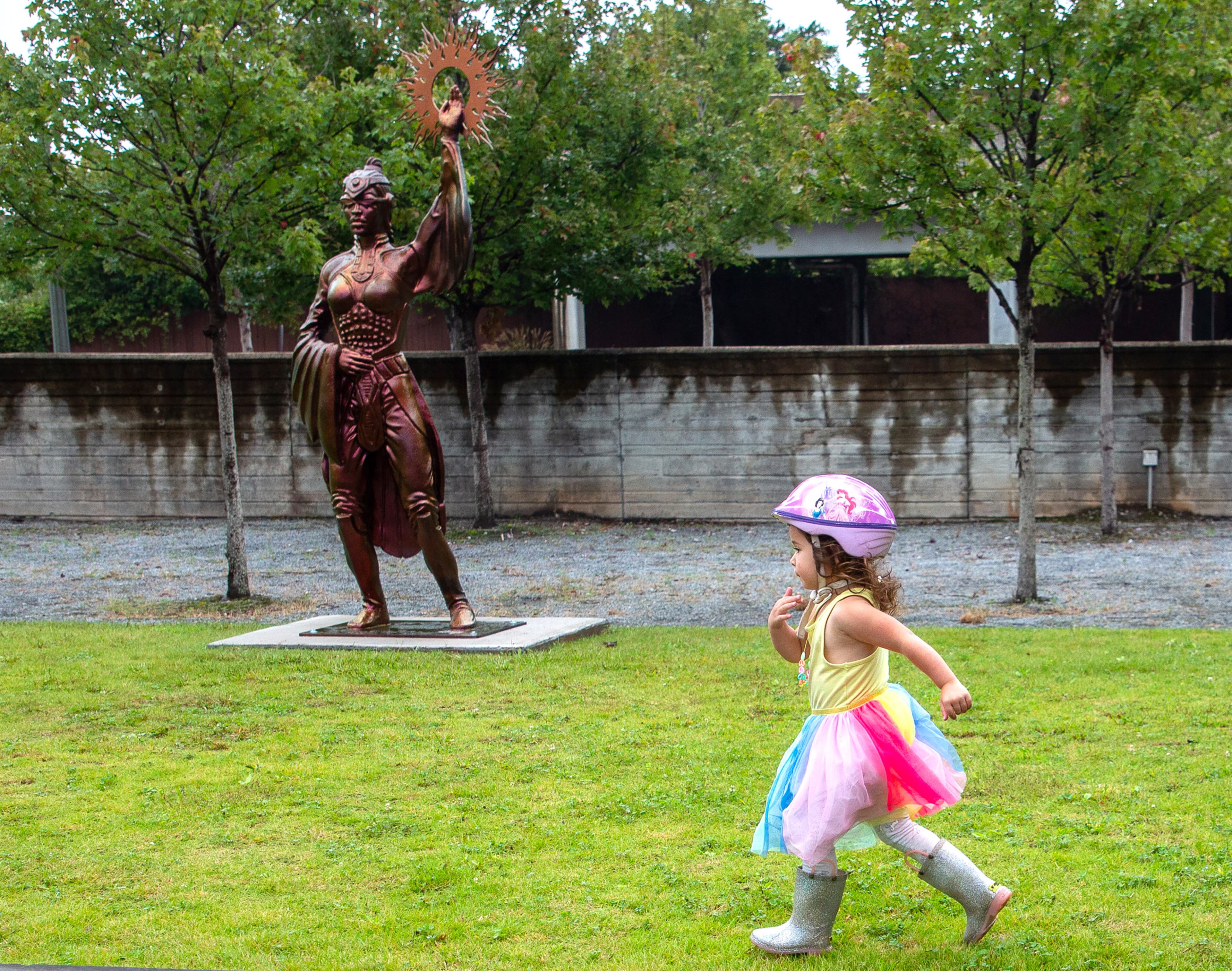 Esme Meraz, 3, plays around the new public art sculpture by artist Ellex Swavoni located in the Beacon Municipal Center Plaza in Decatur on Sunday, September 19, 2021. “What Sonia Said” is the name of the phoenix unveiled in a ceremony last week. STEVE SCHAEFER FOR THE ATLANTA JOURNAL-CONSTITUTION