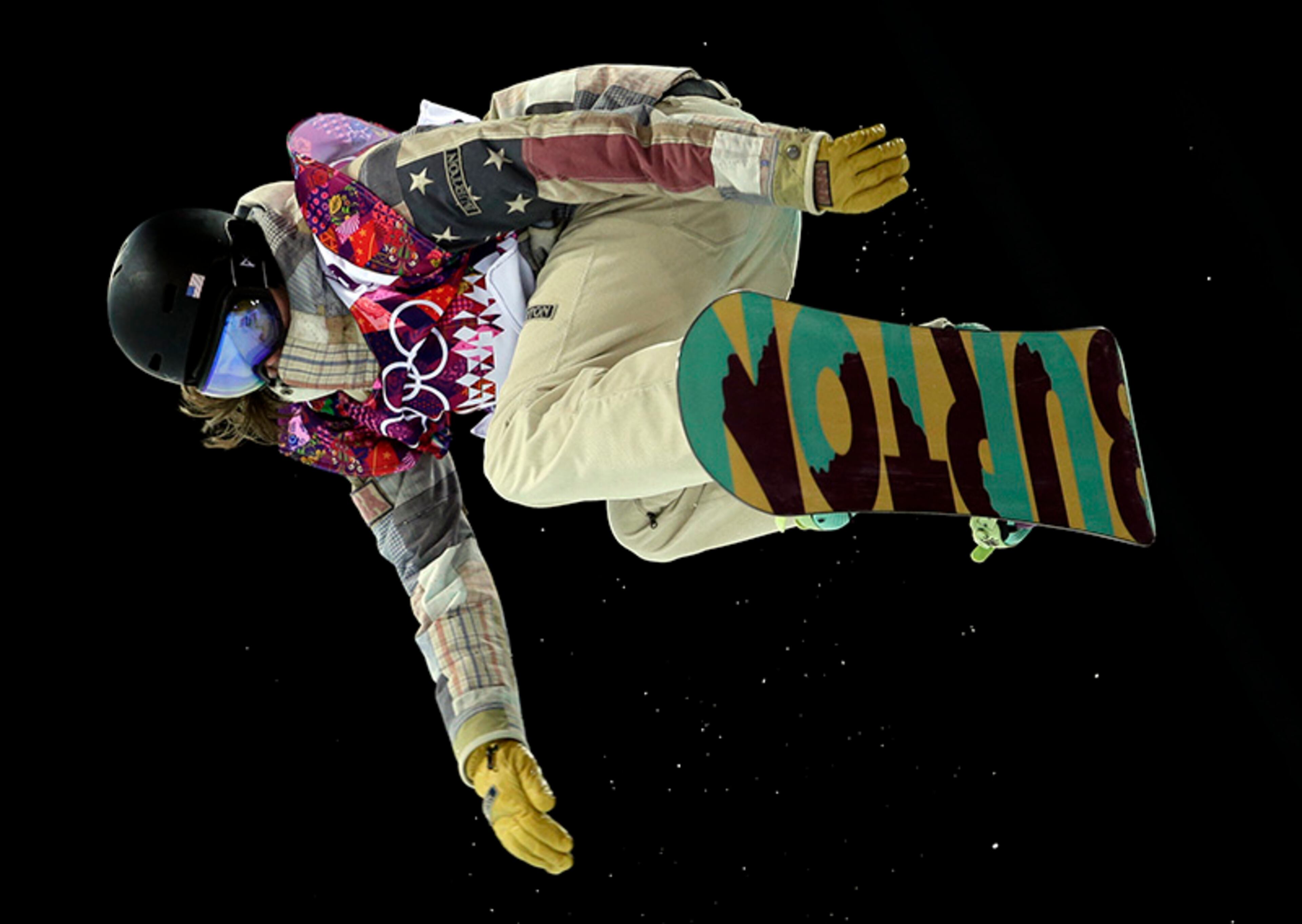 United States' Kelly Clark competes on her way to win the bronze in the women's snowboard halfpipe final at the Rosa Khutor Extreme Park, at the 2014 Winter Olympics, Wednesday, Feb. 12, 2014, in Krasnaya Polyana, Russia.