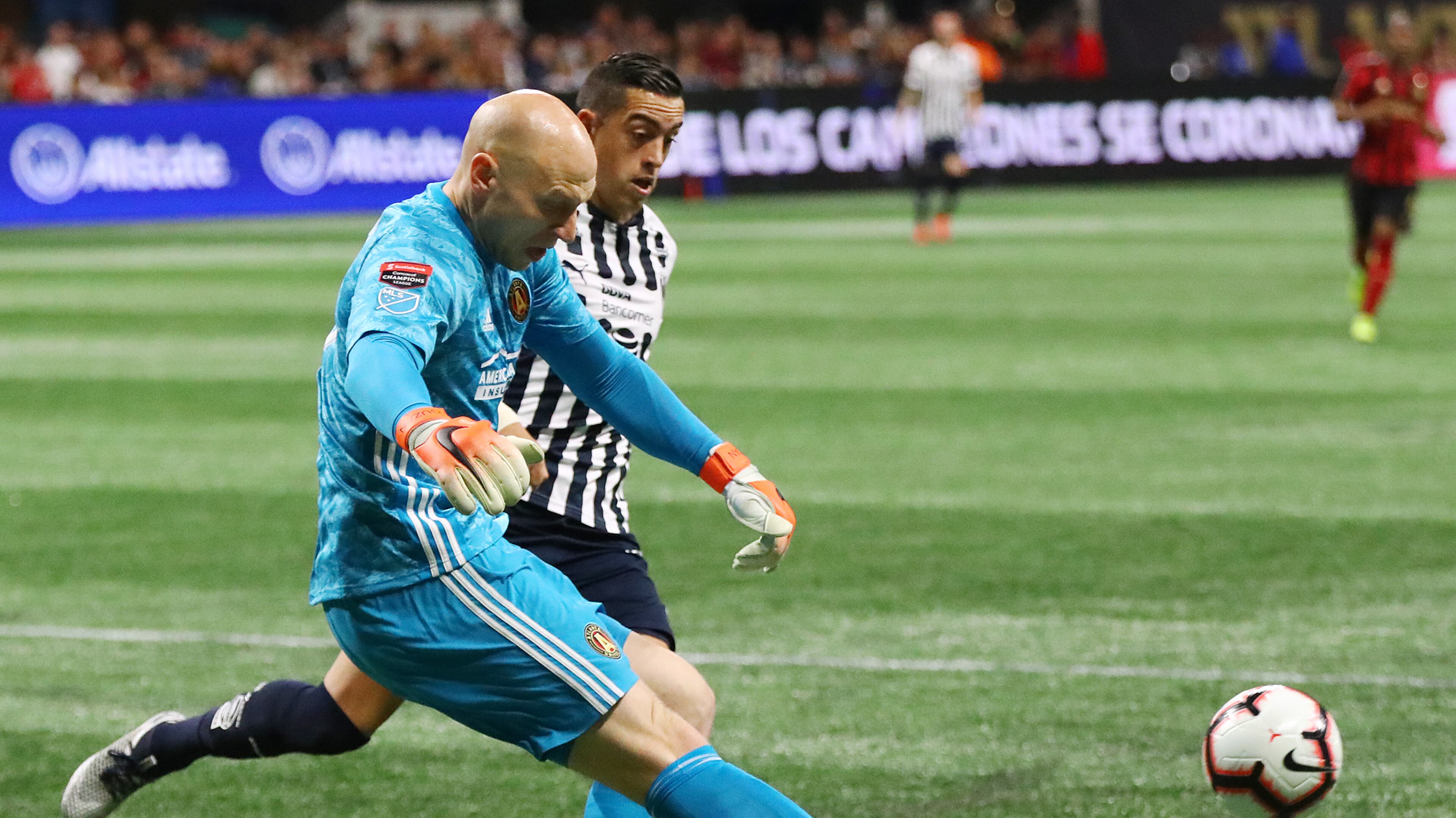 March 13, 2019 Atlanta: Atlanta United goalkeeper Brad Guzan clears the ball away from Monterrey forward Rogelio Funes Mori in a Concacaf Champions league quarterfinal match on Wednesday, March 13, 2019, in Atlanta. Curtis Compton/ccompton@ajc.com