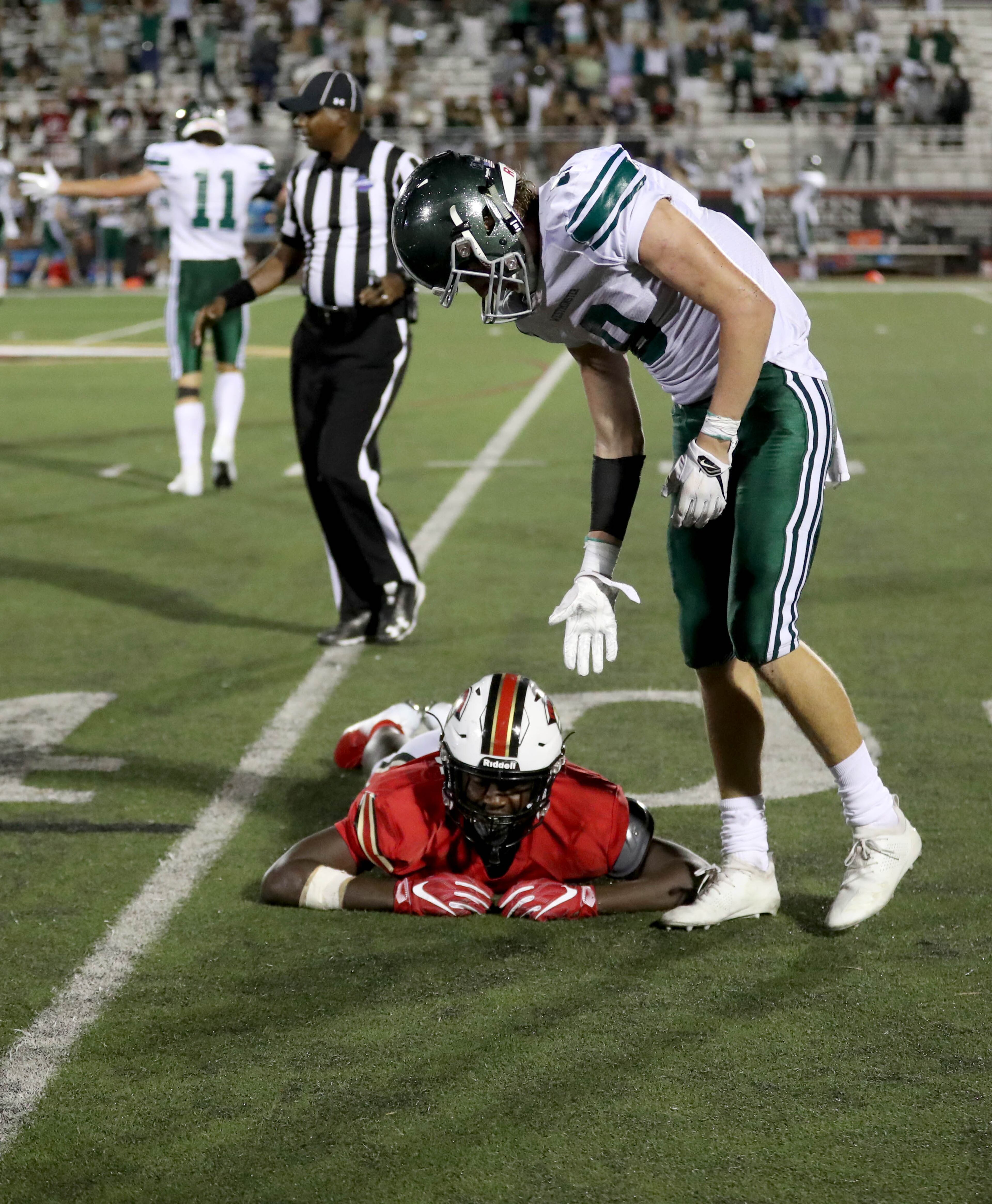 GAC wide receiver Ty James (13) reacts after Westminster defensive back John O. Izlar (8) and teammates deflected a pass intended for James to turn over the ball in the closing minutes of their game at Greater Atlanta Christian Friday, August 24, 2018, in Norcross, Ga. Westminster won 22-21. PHOTO / JASON GETZ