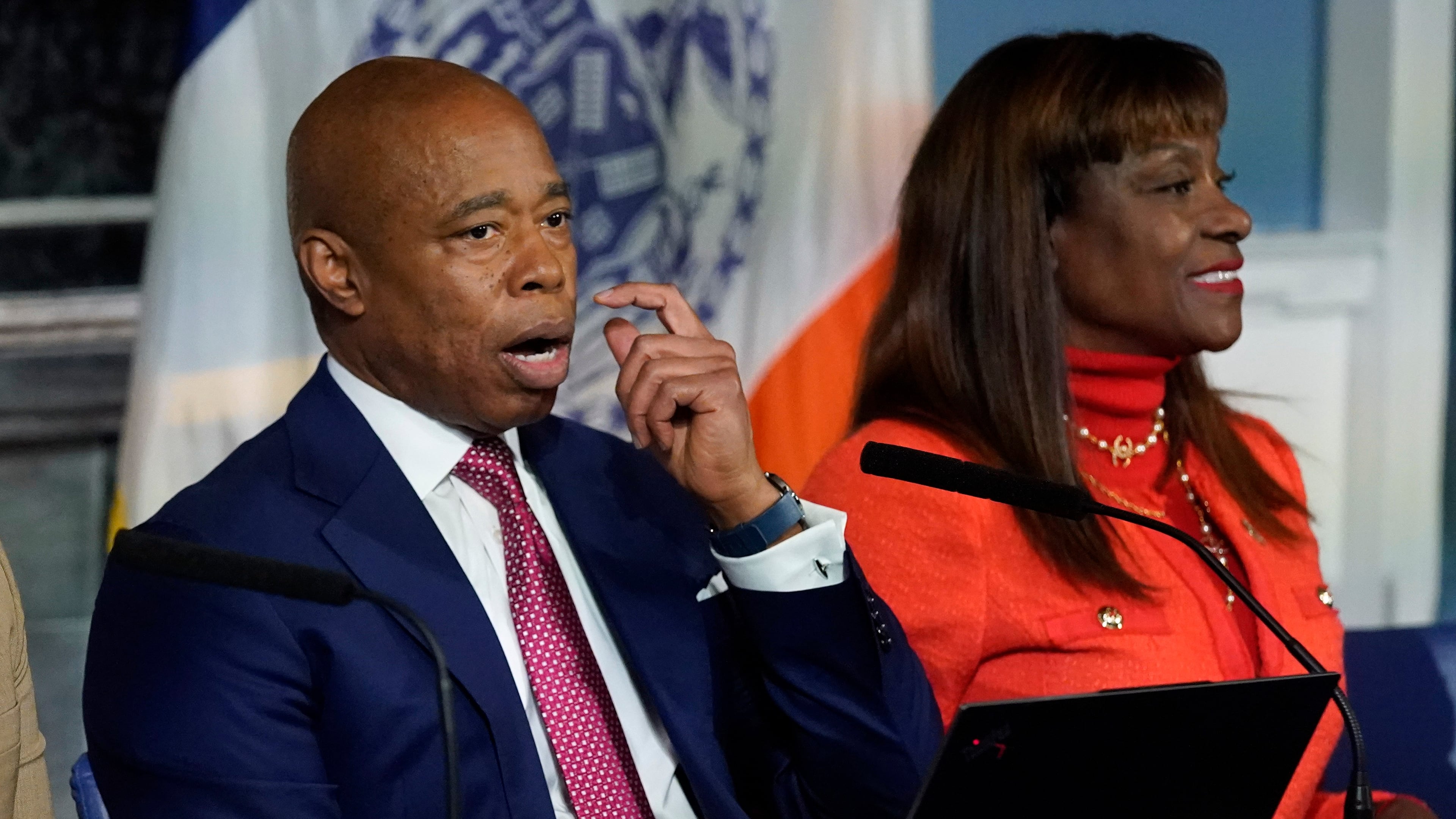 FILE - New York Mayor Eric Adams, accompanied by Ingrid Lewis-Martin, his chief advisor, responds to questions during a news conference at New York's City Hall, Nov. 14, 2023. (AP Photo/Richard Drew, File)