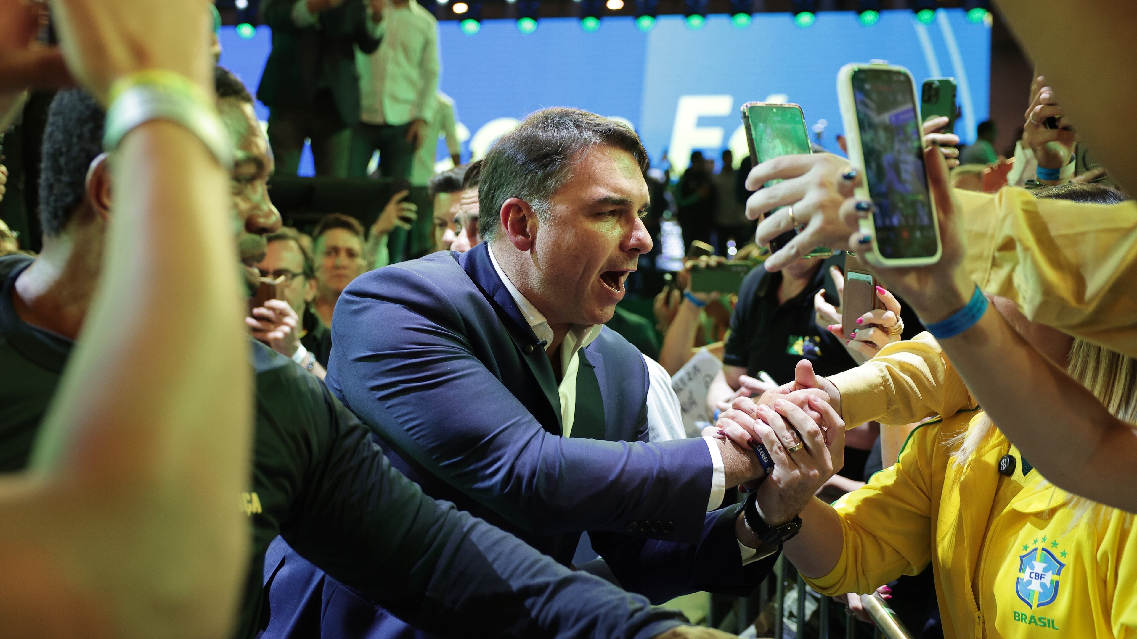 Brazilian Sen. Flavio Bolsonaro greets supporters as he arrives to the Liberal Party convention where he was confirmed as the party's presidential candidate, in Sao Paulo, Saturday, July 25, 2026. (AP Photo/Ettore Chiereguini)