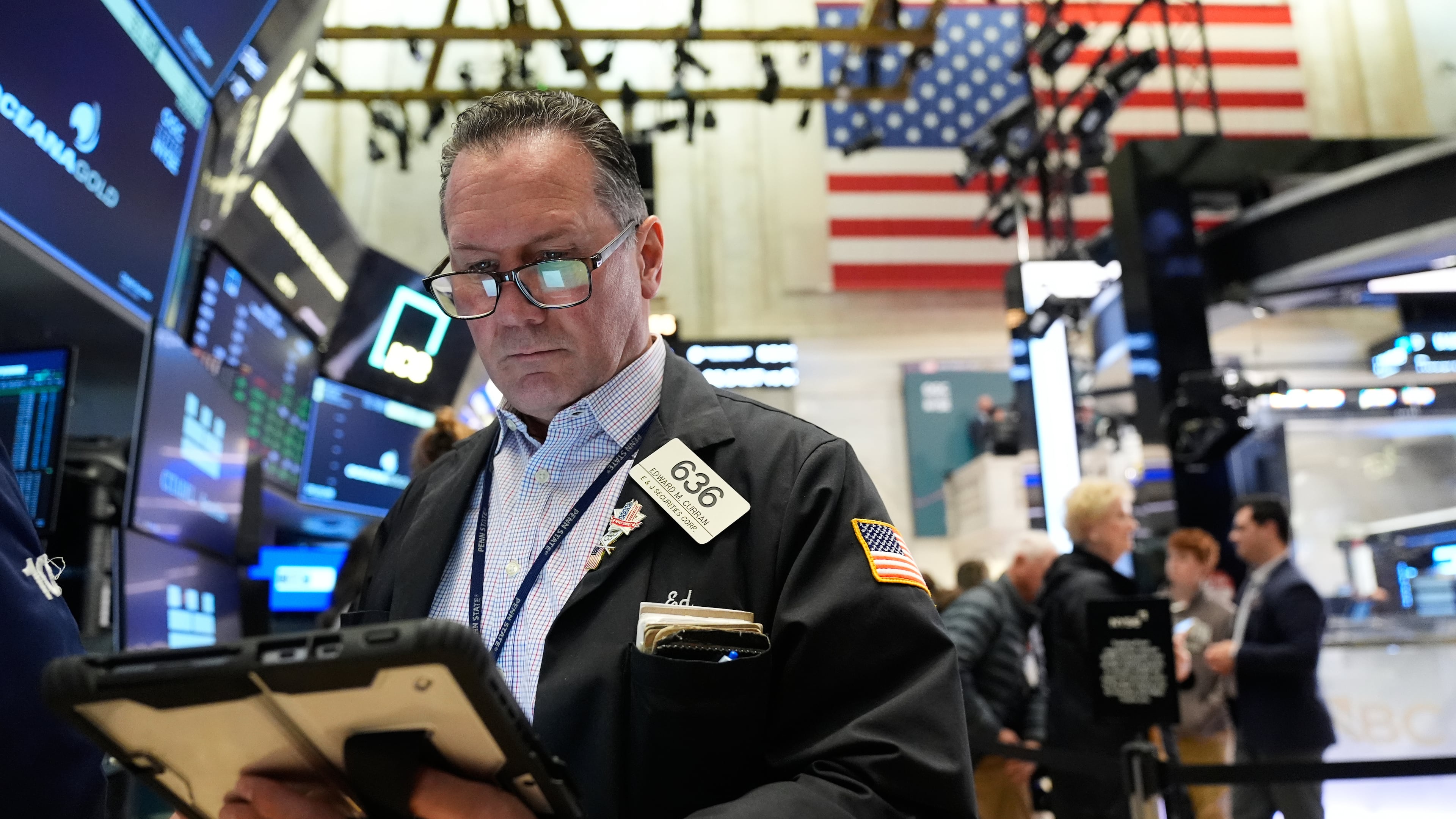Ed Curran works on the floor at the New York Stock Exchange in New York, Tuesday, April 7, 2026. (AP Photo/Seth Wenig)
