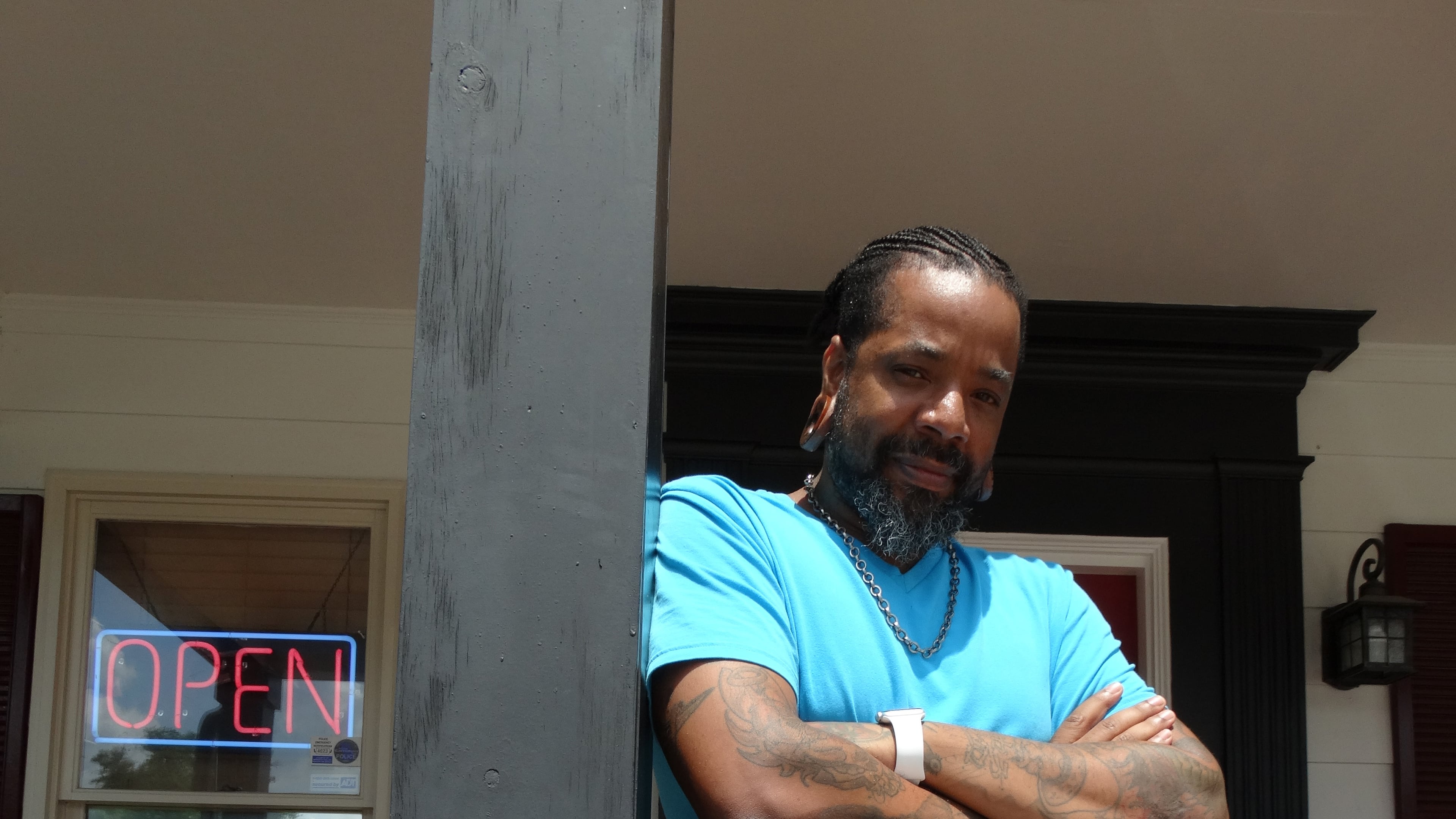 Craig Foster in the entrance of his Carrollton Inkwerks Tattoo & Design in June, 2015. CREDIT: Rodney Ho/rho@ajc.com