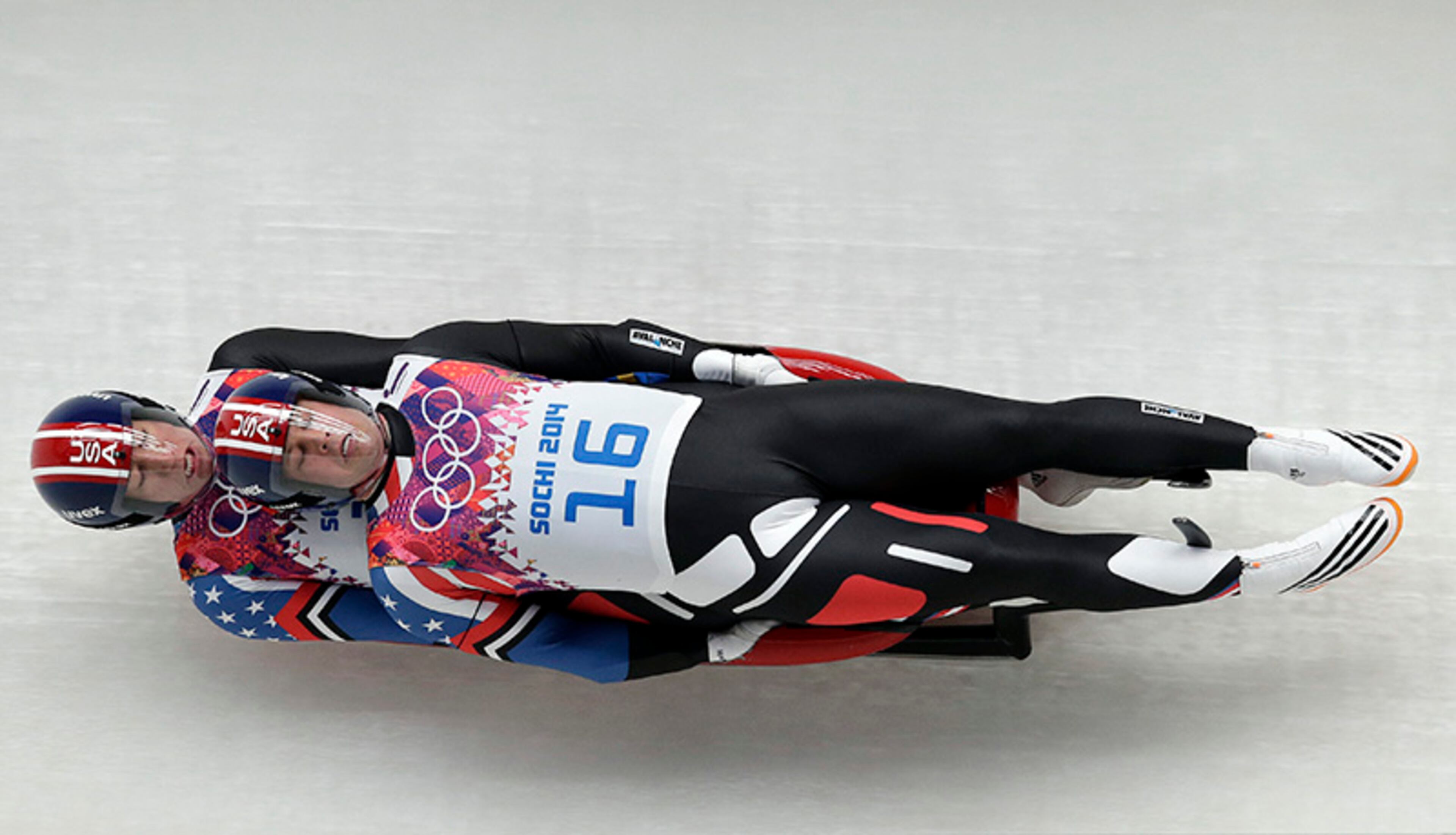 The doubles team of Matthew Mortensen and Preston Griffall of the United States speed down the track in their first run during the men's doubles luge at the 2014 Winter Olympics, Wednesday, Feb. 12, 2014, in Krasnaya Polyana, Russia.