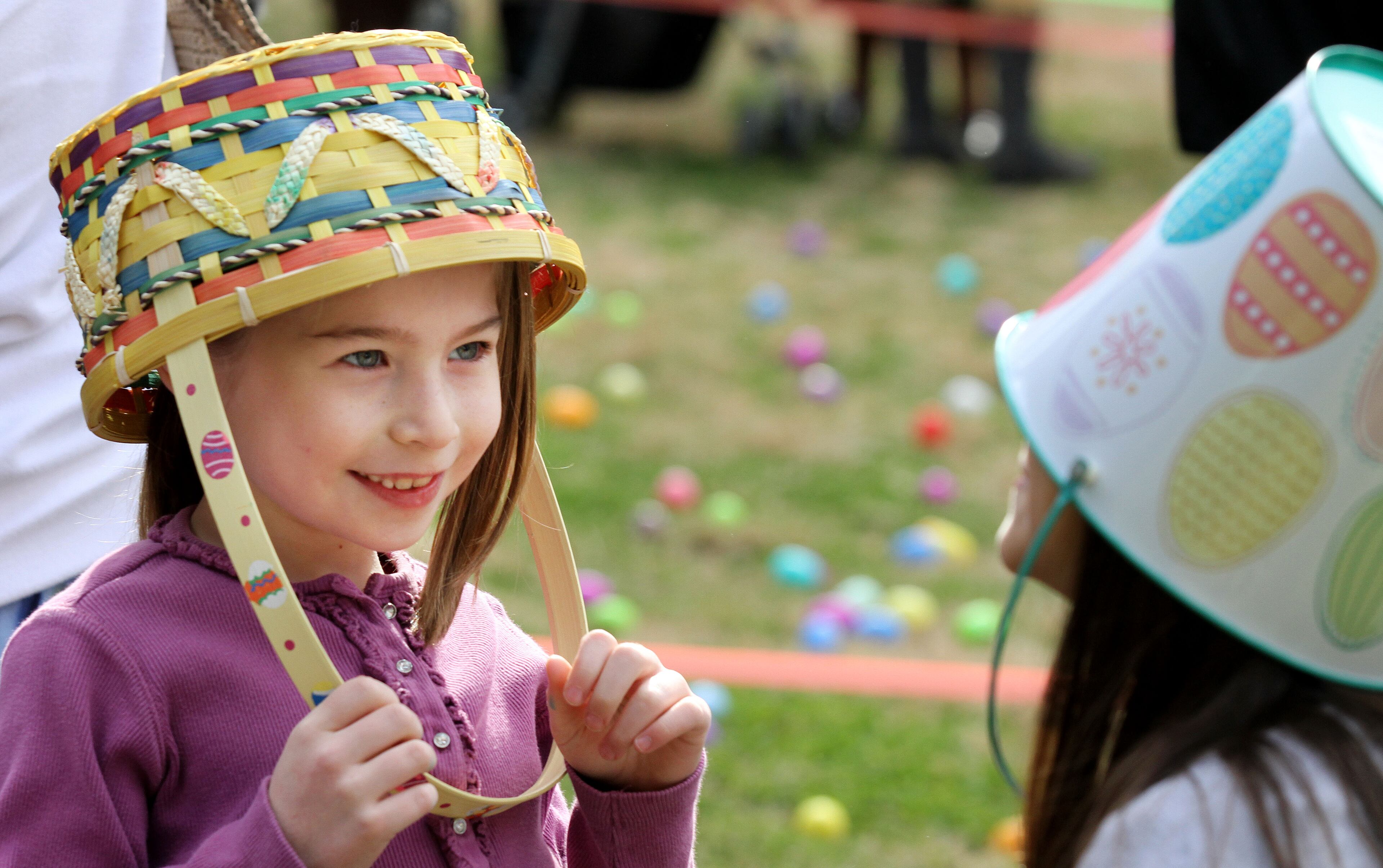 Gabbie Deocampo (left) & her friend Hamah Bowers (both age 7) play with their Easter baskets before the City of Avondale Estates Annual Easter Egg Hunt at the Community Club on Lake Avondale on Sat. March 30th, 2013.
