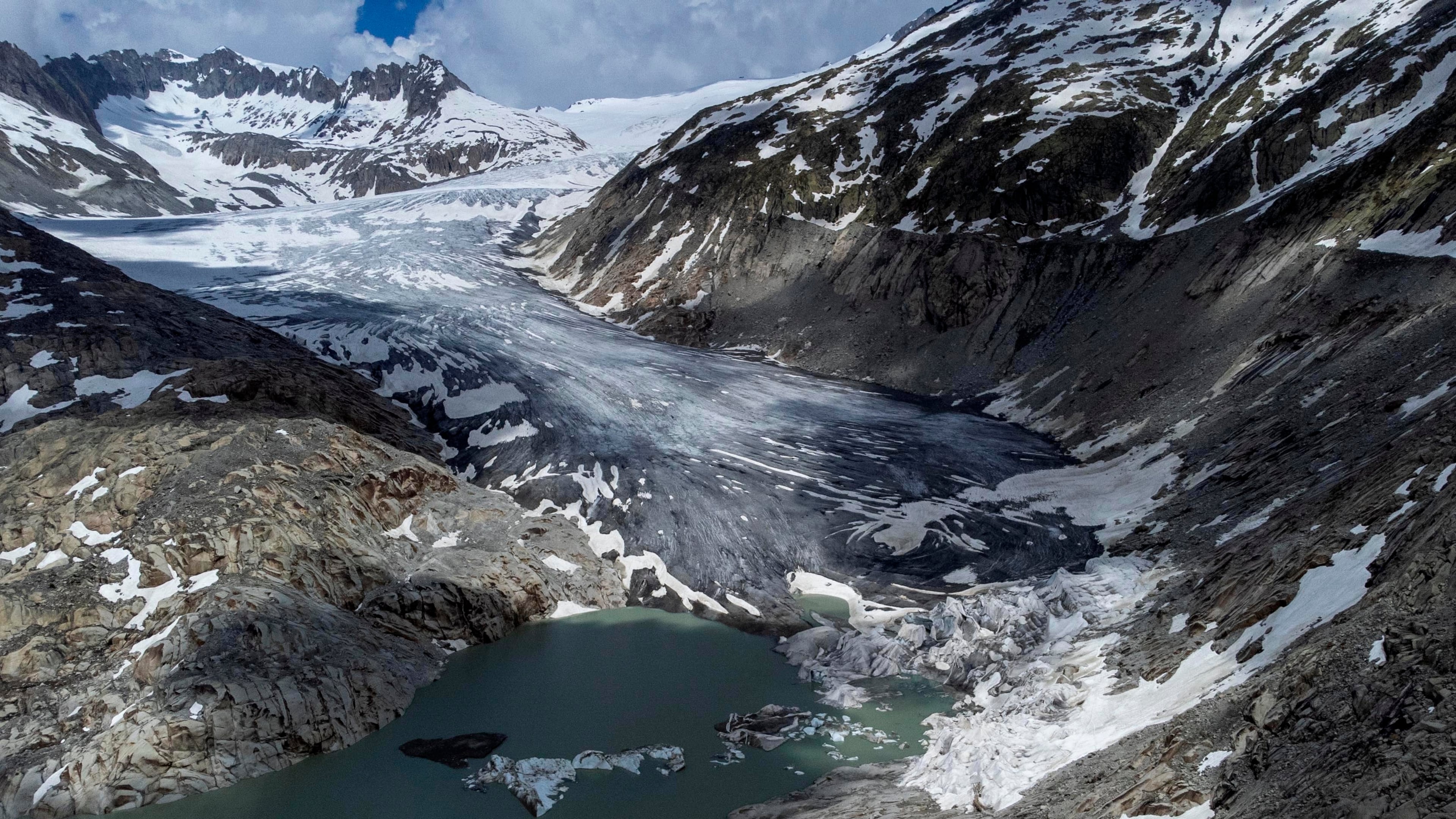 FILE — A lake of meltwater has formed on the tongue of the Rhone glacier near Goms, Switzerland, June 13, 2023. (AP Photo/Matthias Schrader, File)