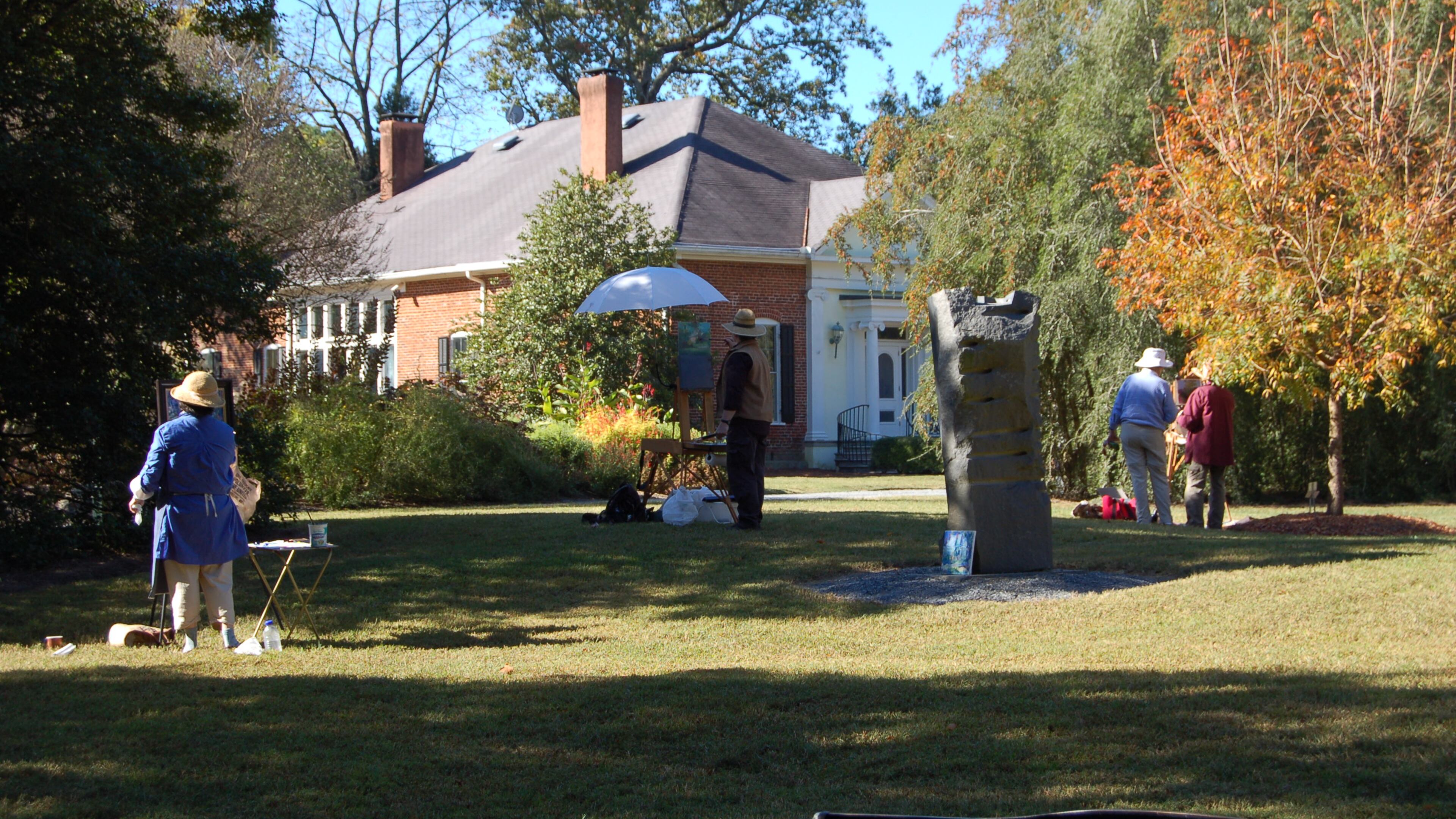 Painting in open air or plein air painting is one of the many health and wellness activities during “A Healthier You” at Smith-Gilbert Gardens. Pictured is a class that took place in the Knowlton Meadow facing the Hiram Butler House at SGG.