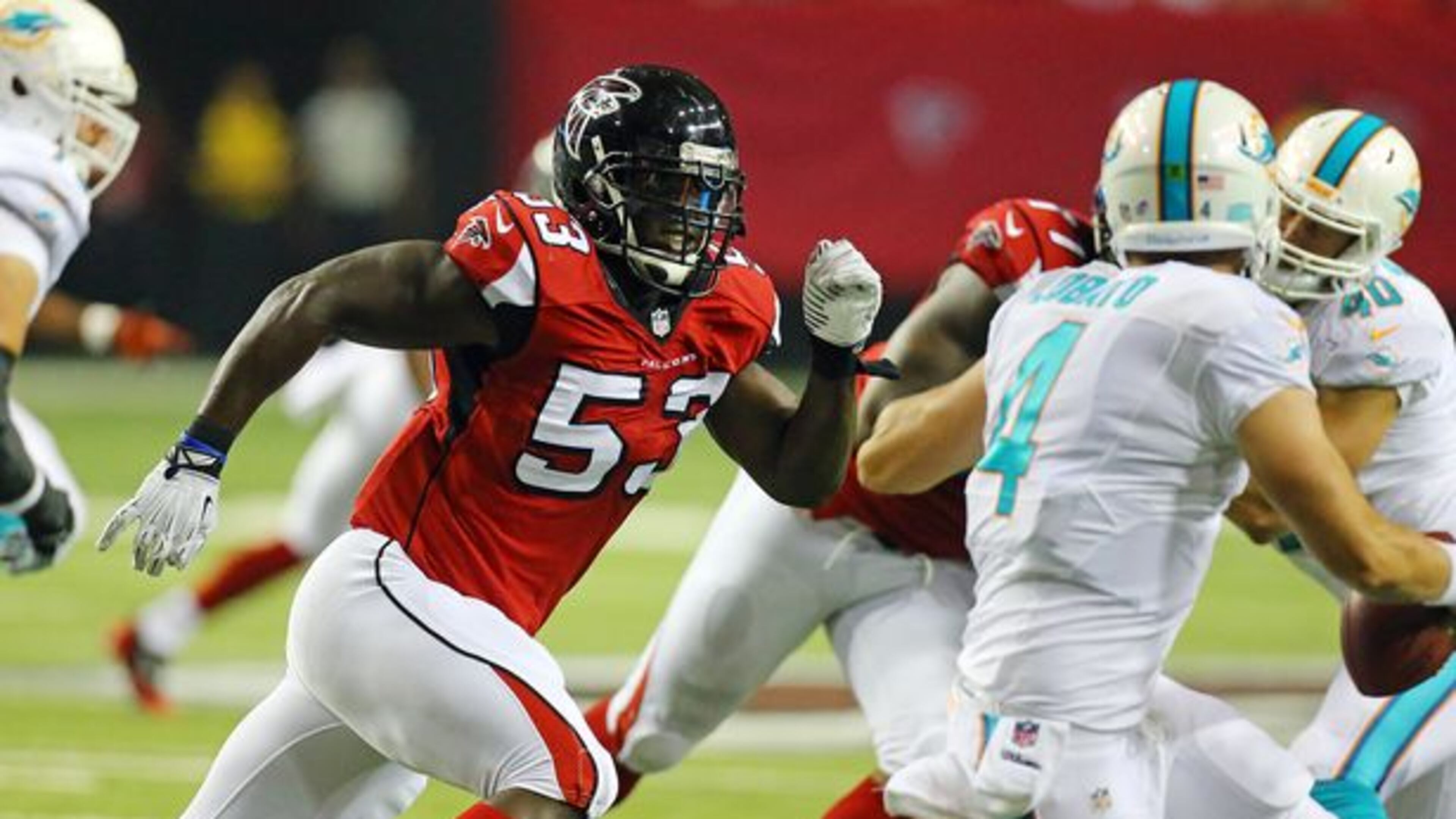 Falcons linebacker Prince Shembo sacks Miami quarterback Seth Lobato during the second half of their NFL exhibition game on Friday, August 8, 2014, in Atlanta. (Curtis Compton/Ccompton@ajc.com)