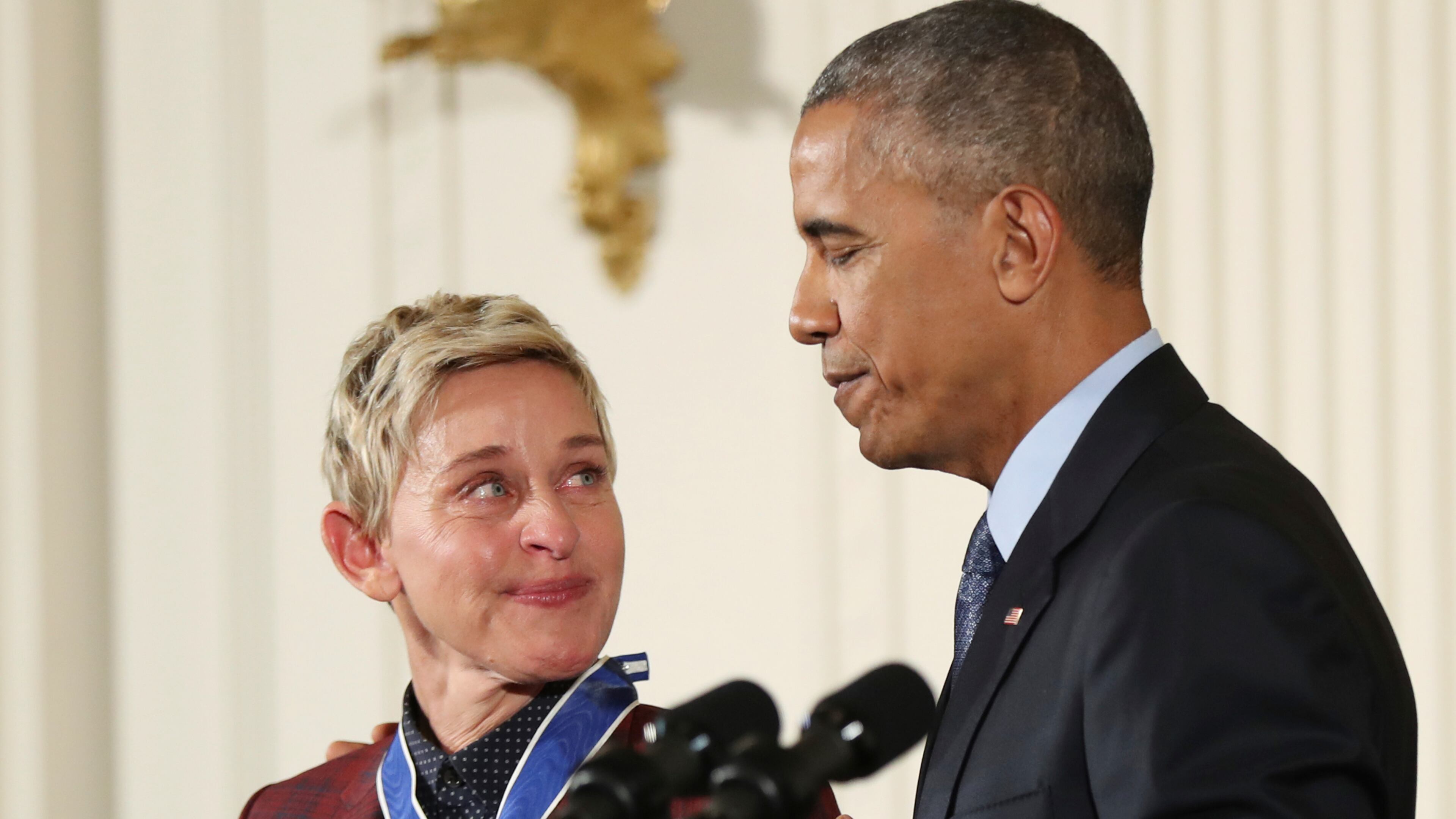 Actress, comedian, and talk show host Ellen DeGeneres, glances at President Barack Obama as she is presented the Presidential Medal of Freedom during a ceremony in the East Room of the White House Tuesday, Nov. 22, 2016, in Washington. Obama is recognizing 21 Americans with the nation's highest civilian award, including giants of the entertainment industry, sports legends, activists and innovators. (AP Photo/Manuel Balce Ceneta)