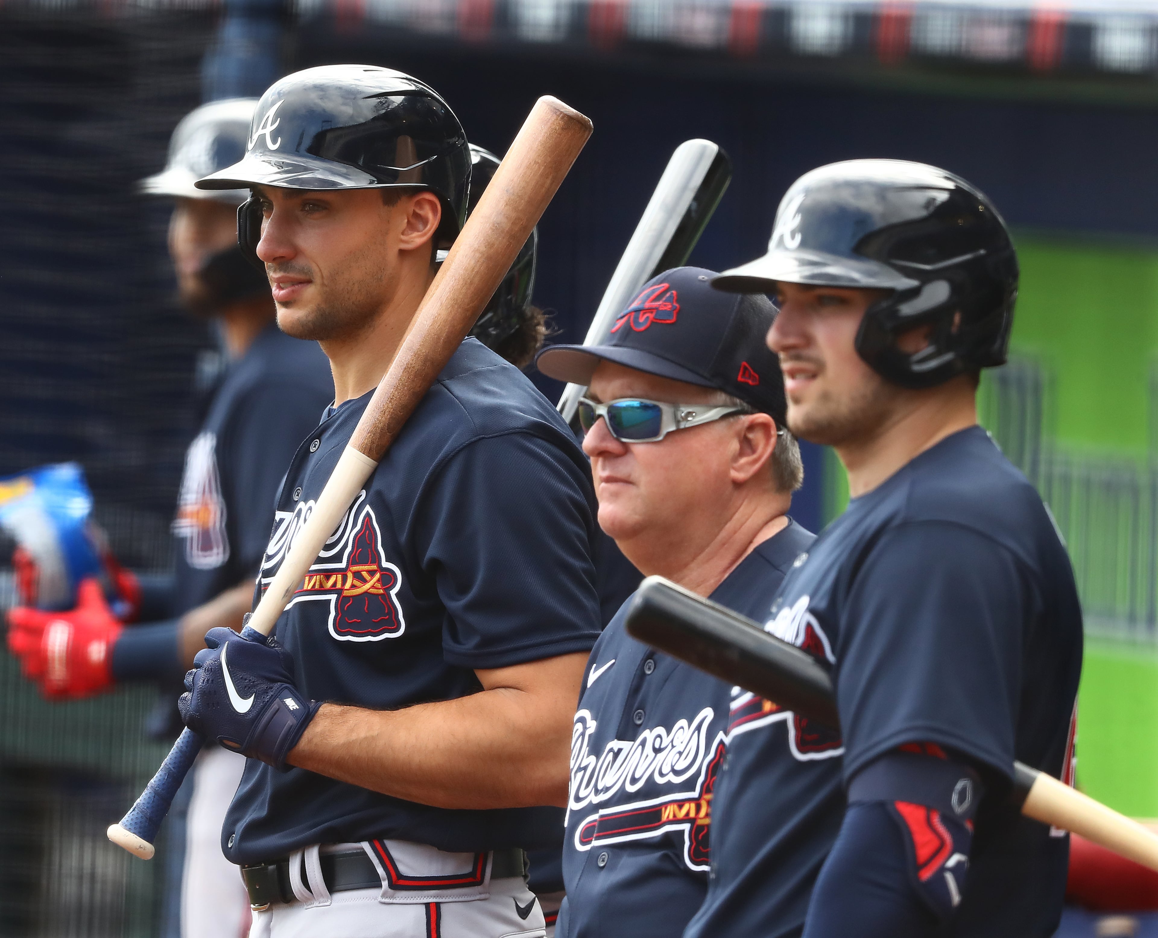 031622 North Port: Atlanta Braves first baseman Matt Olson (from left), hitting coach Kevin Seitzer, and third baseman Austin Riley watch pitcher Dylan Lee throw live batting practice during Spring Training at CoolToday Park on Wednesday, March 16, 2022, in North Port. “Curtis Compton / Curtis.Compton@ajc.com”