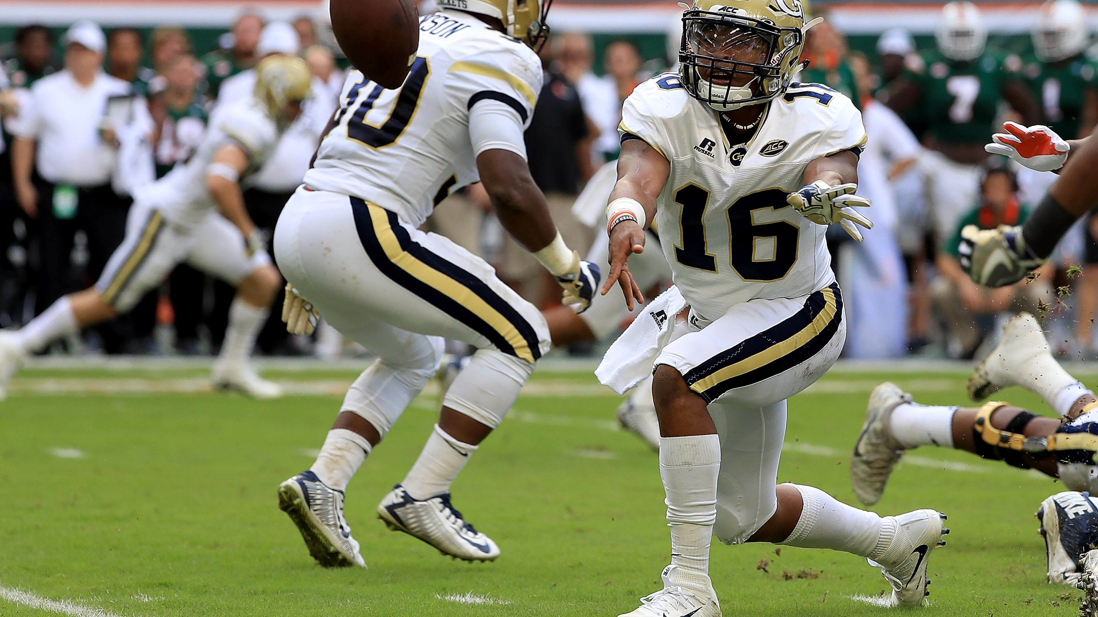 MIAMI GARDENS, FL - OCTOBER 14: TaQuon Marshall #16 of the Georgia Tech Yellow Jackets pitches the ball during a game against the Miami Hurricanes at Sun Life Stadium on October 14, 2017 in Miami Gardens, Florida. (Photo by Mike Ehrmann/Getty Images)