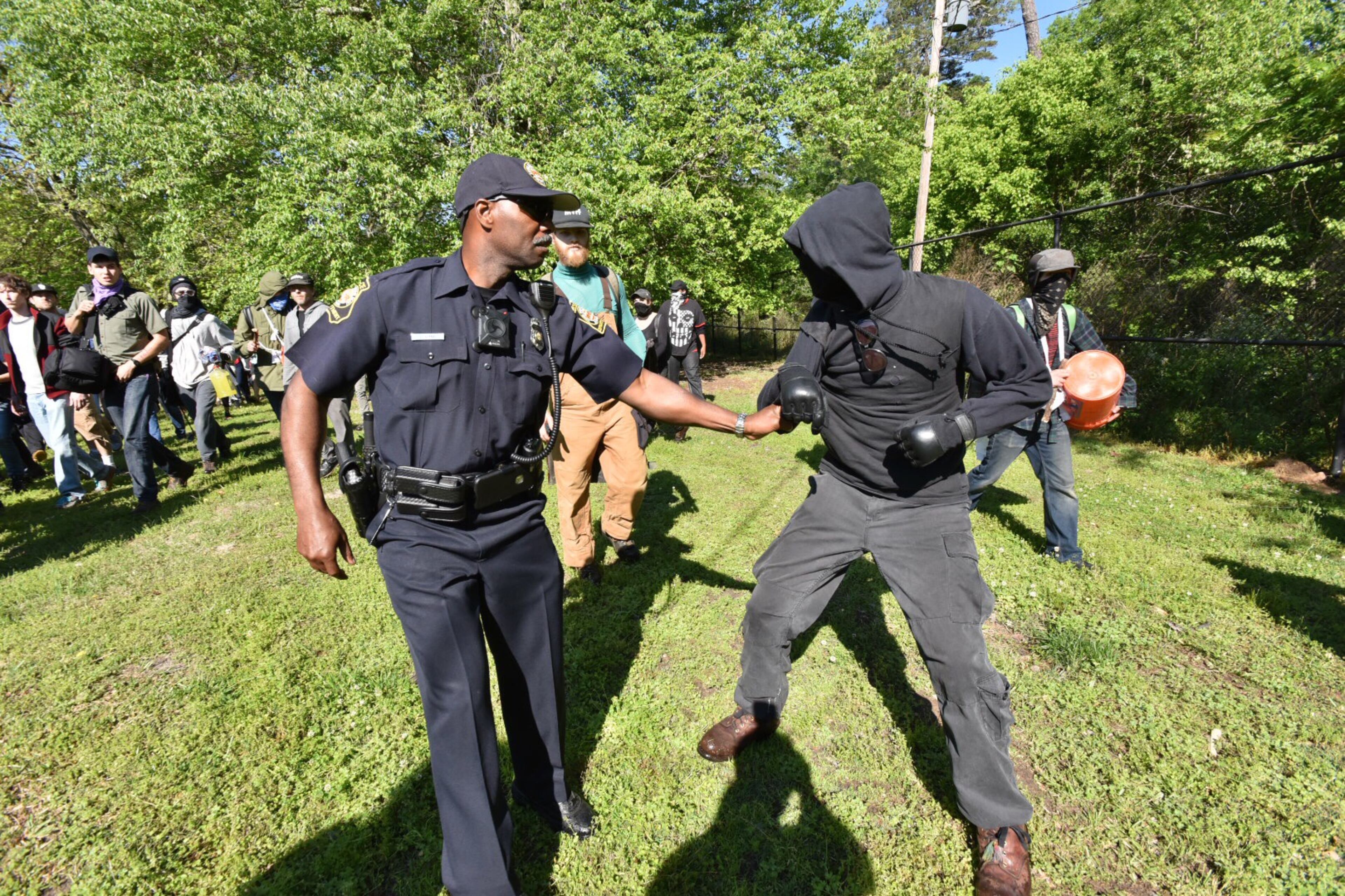 Protesters clash with police near a “white power” rally in Stone Mountain on Saturday, April 23, 2016. The protesters said they are opposing the message of hate at the supremacist rally also taking place at the park.